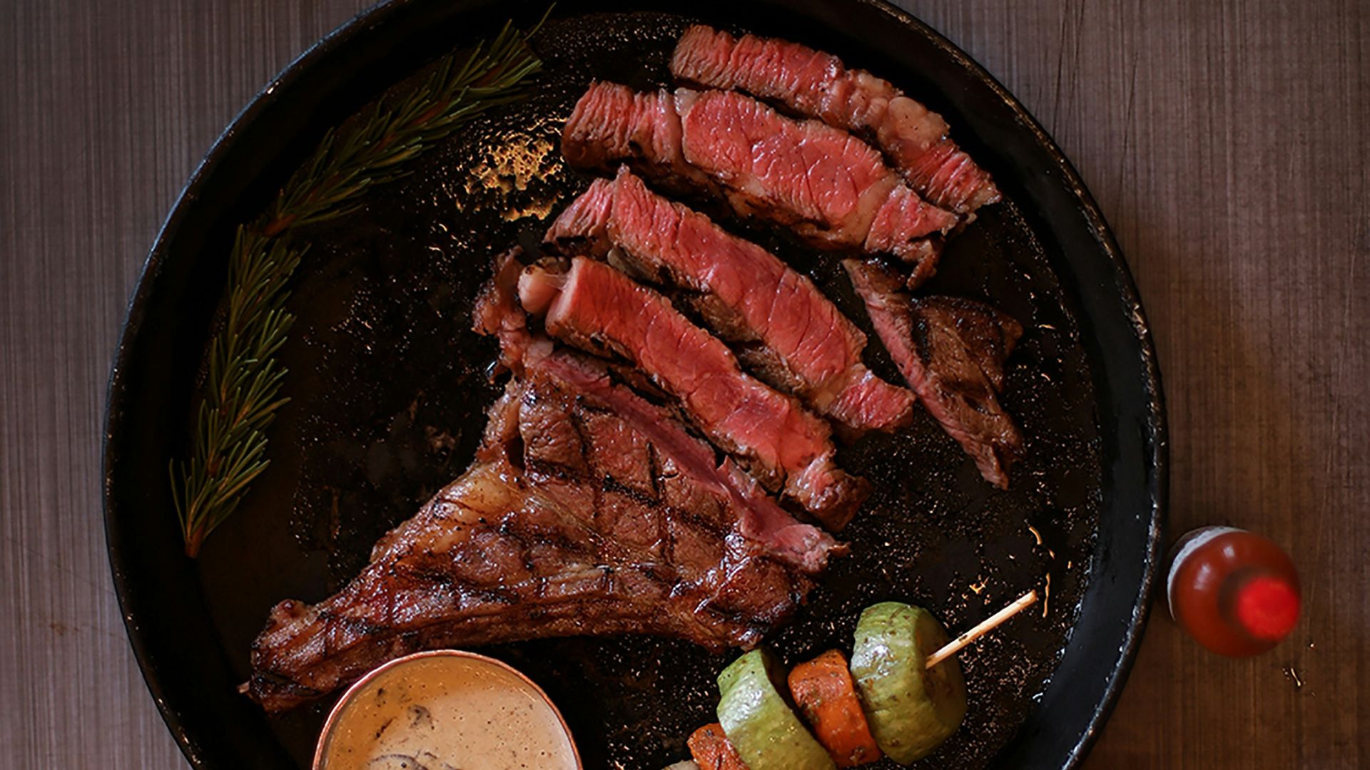 a plate of meat and vegetables on a table