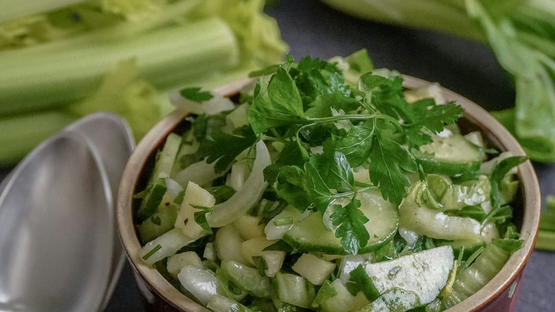 green vegetable on red ceramic bowl