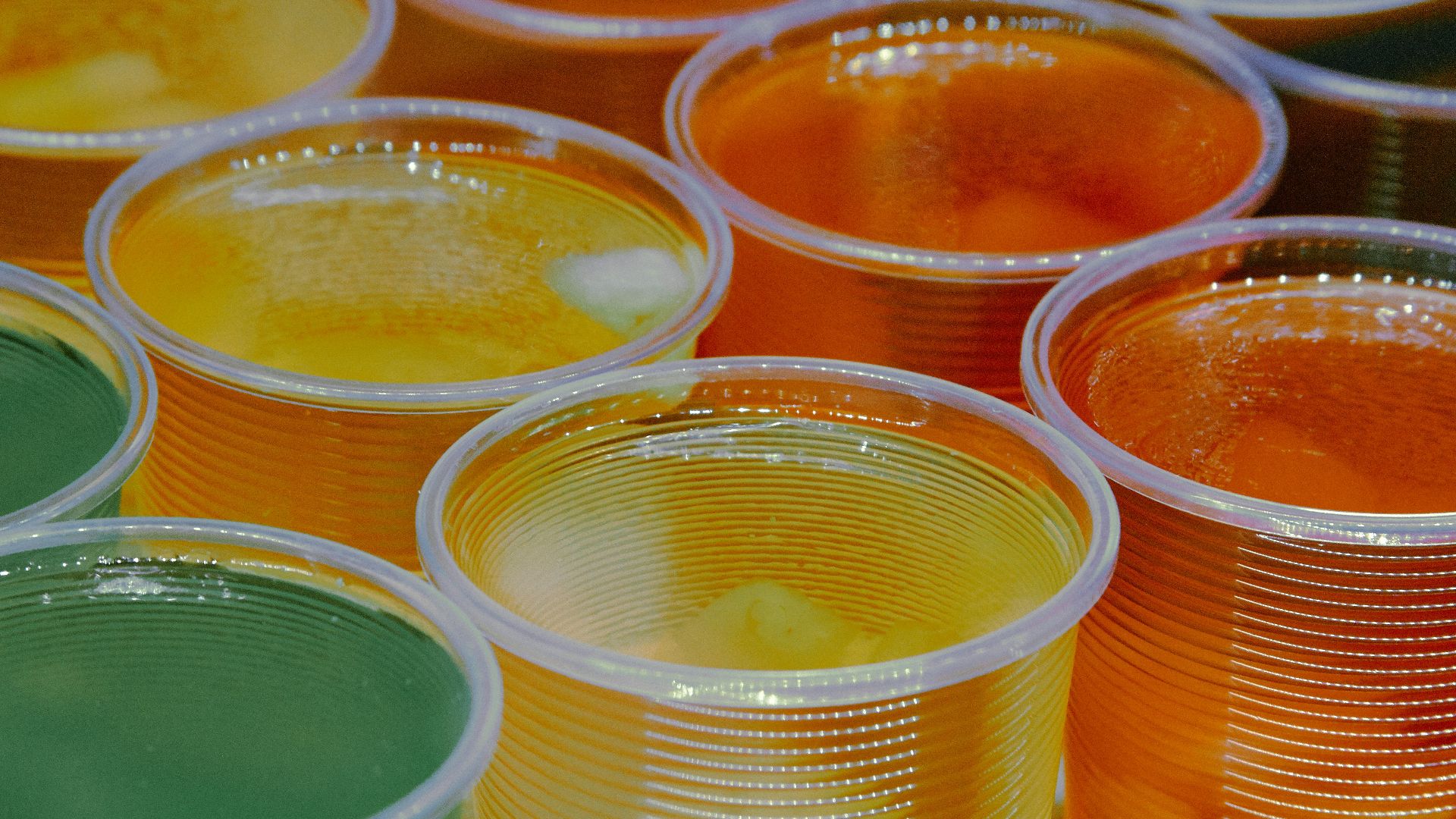 clear glass jars with yellow liquid