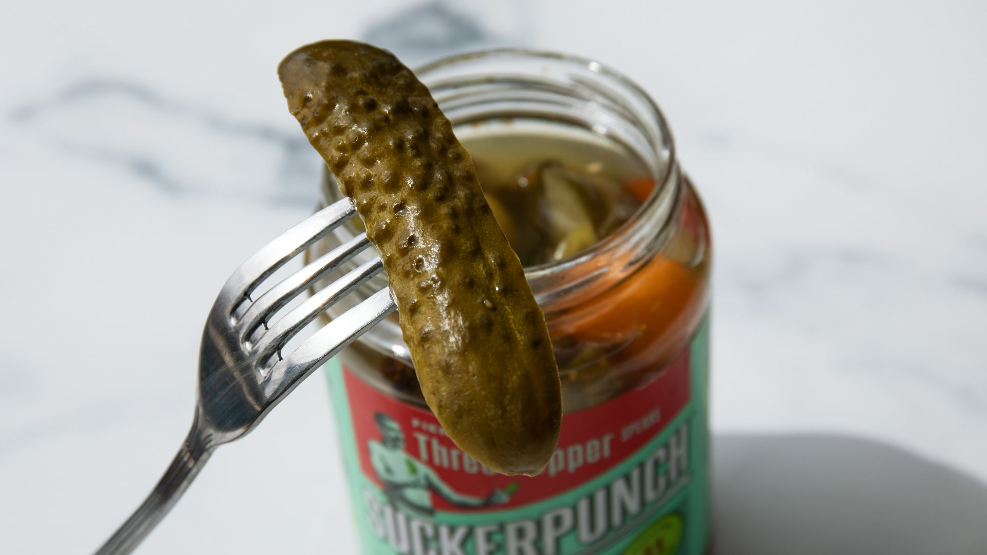stainless steel fork on green labeled can