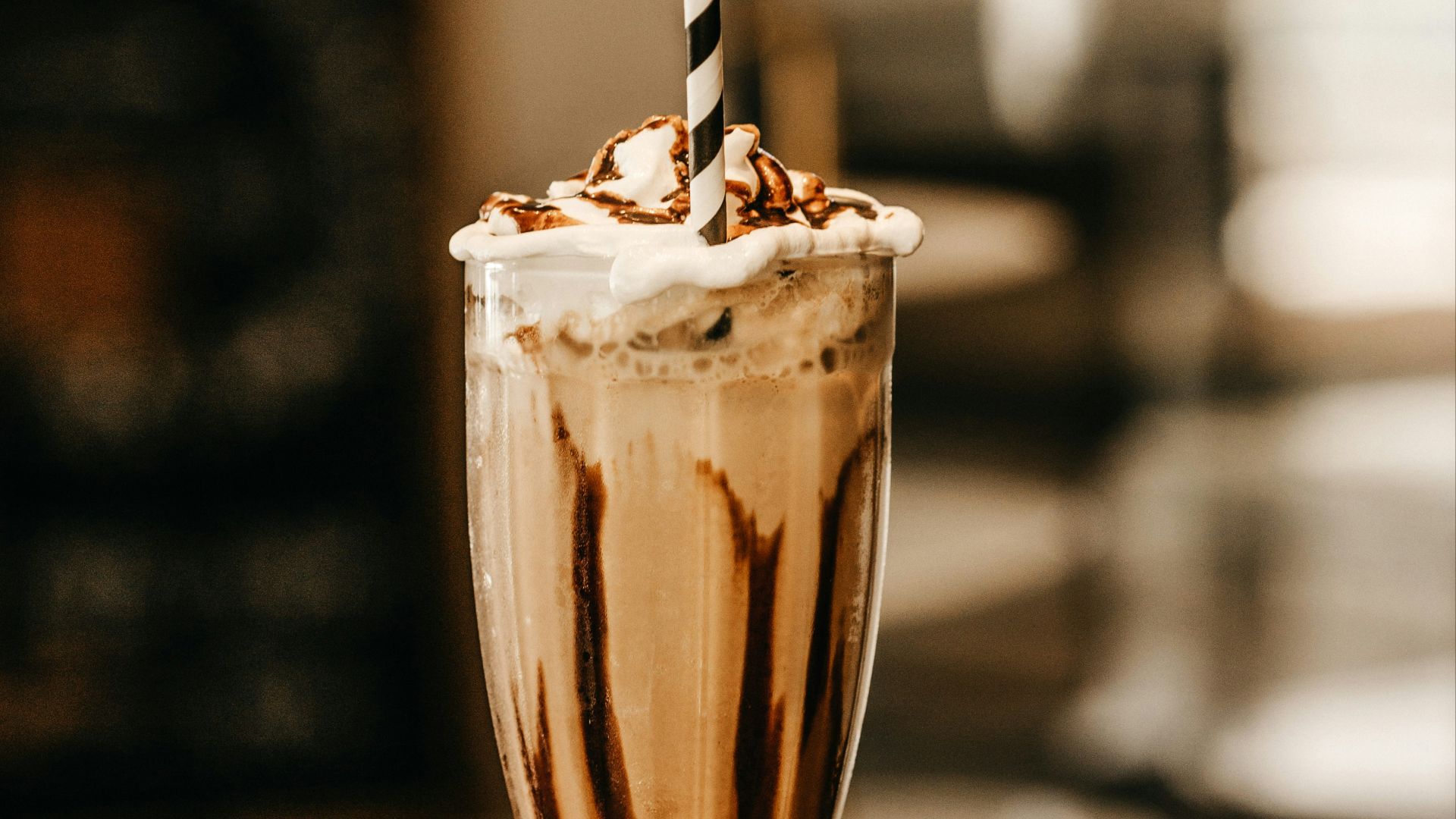 full-filled cream glass on table