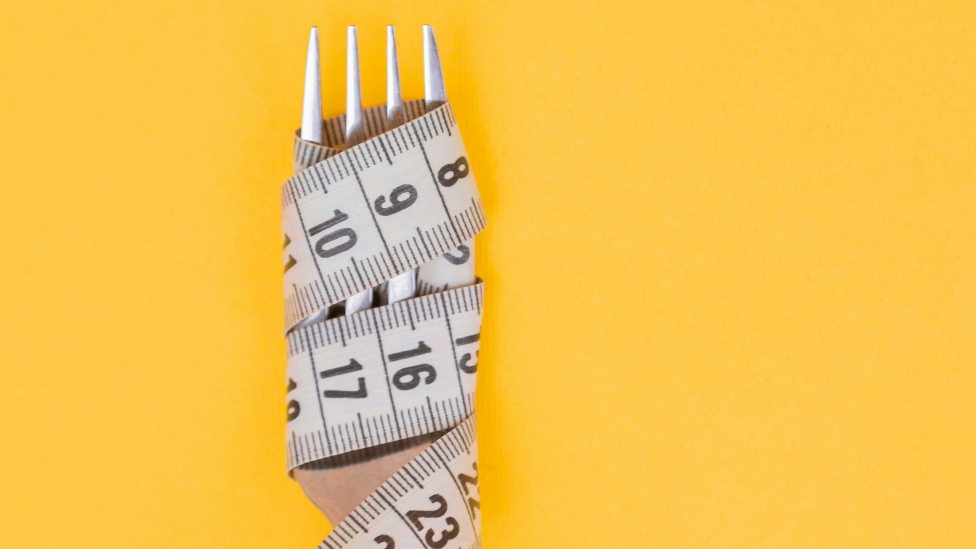 white and black pencil on yellow surface