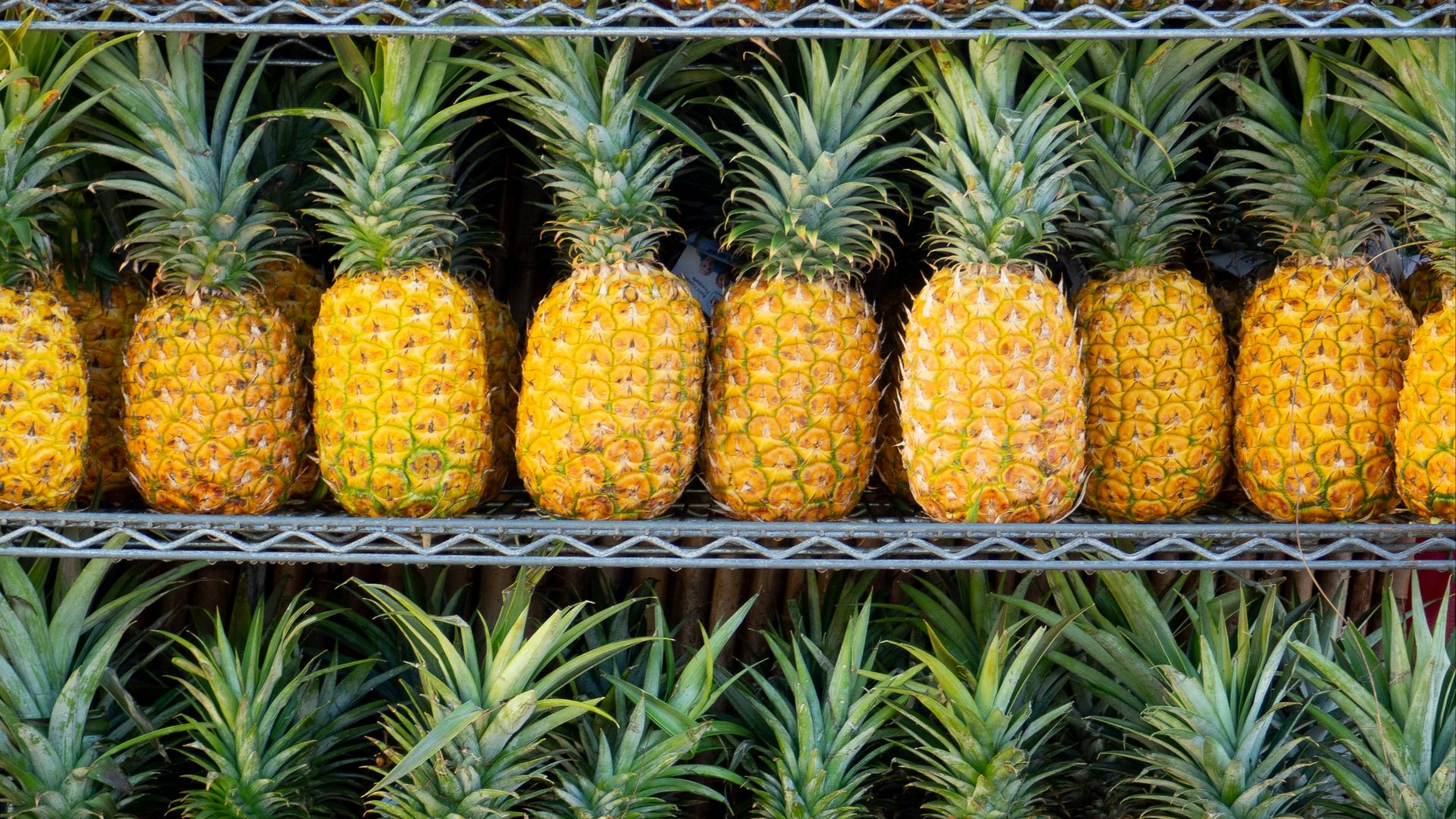 ripe pineapple fruits on shelf