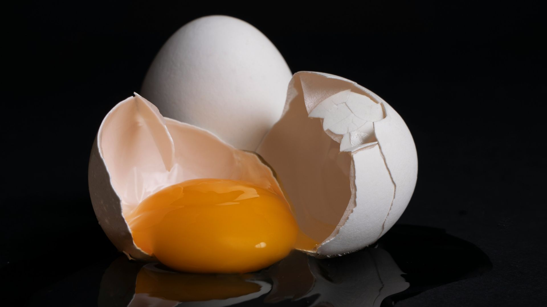 white egg on brown wooden tray