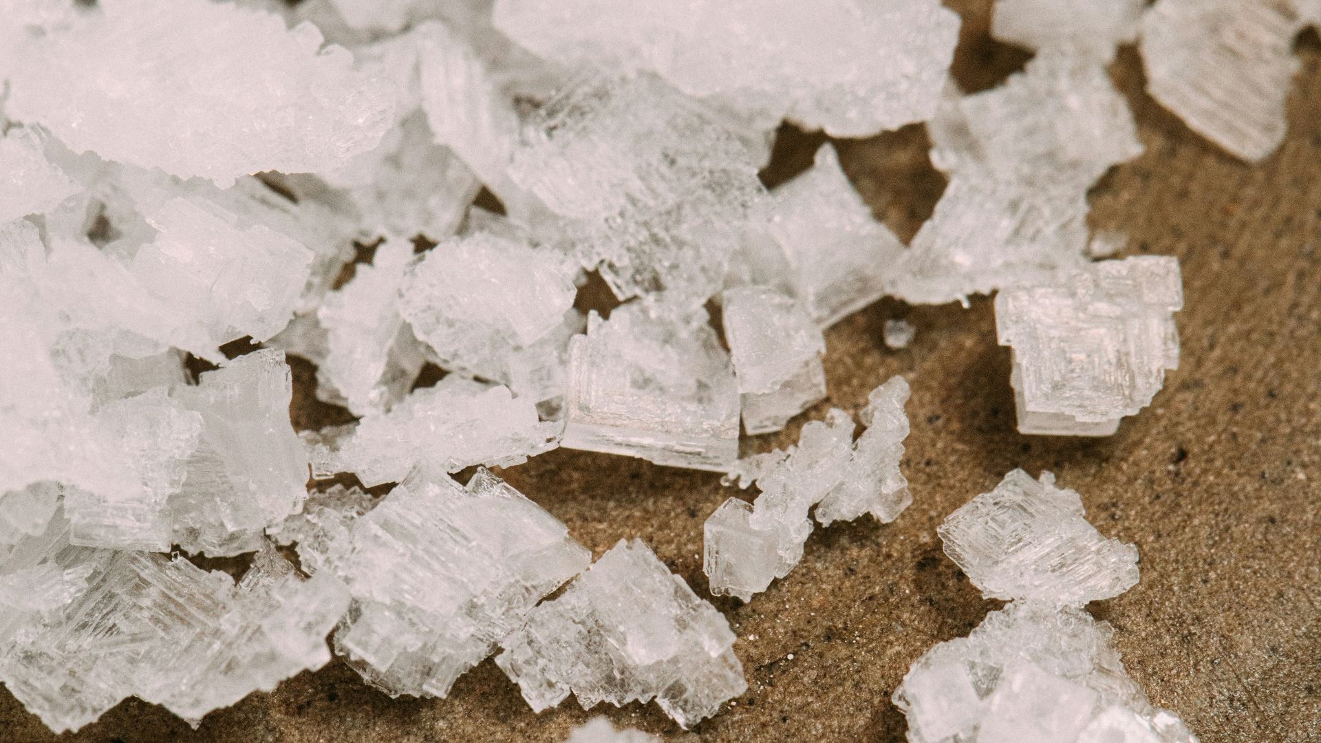 white snow on brown sand