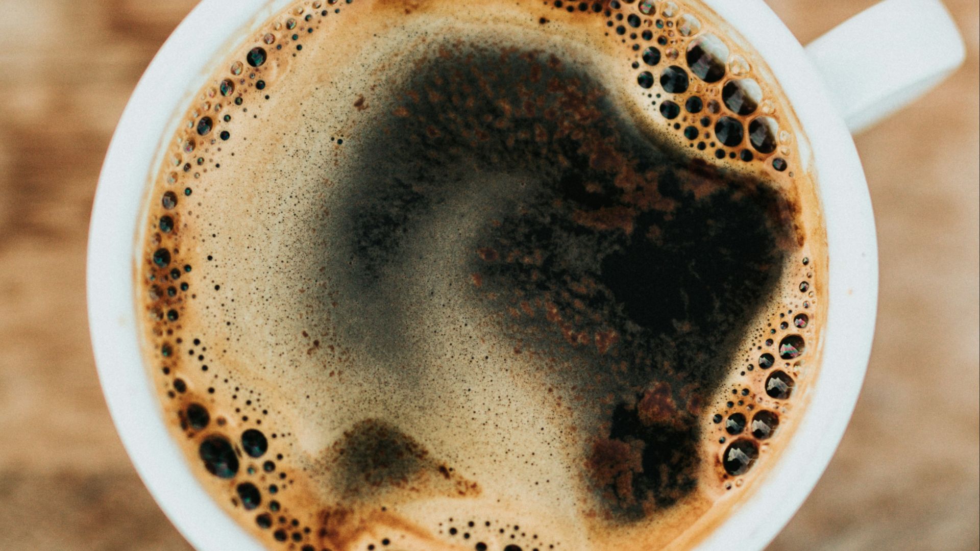 white ceramic mug filled with coffee