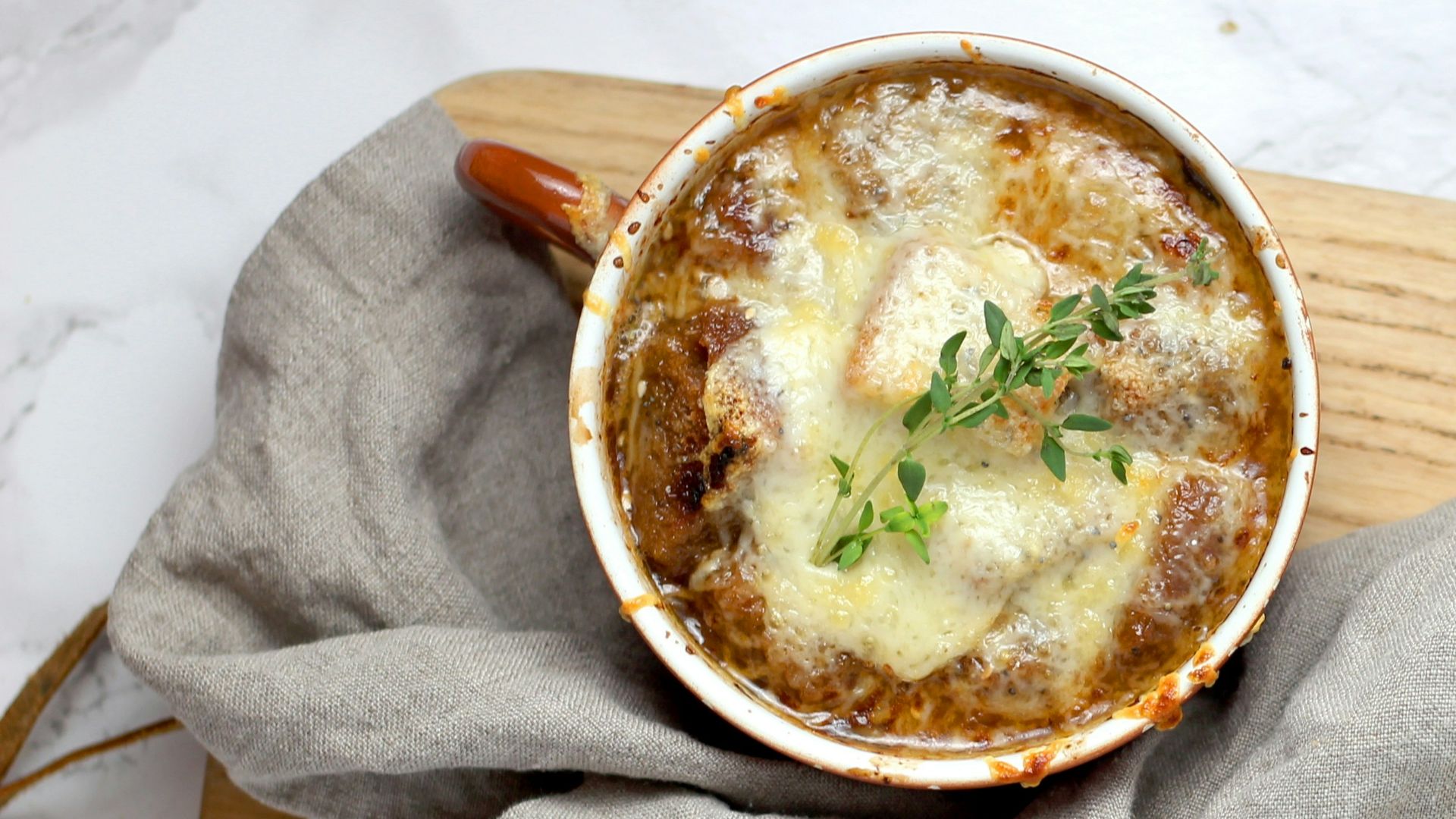 soup with green leaf in teacup