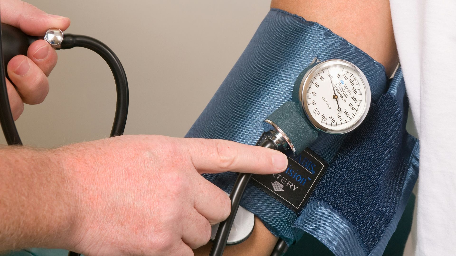 a doctor checking the blood pressure of a patient
