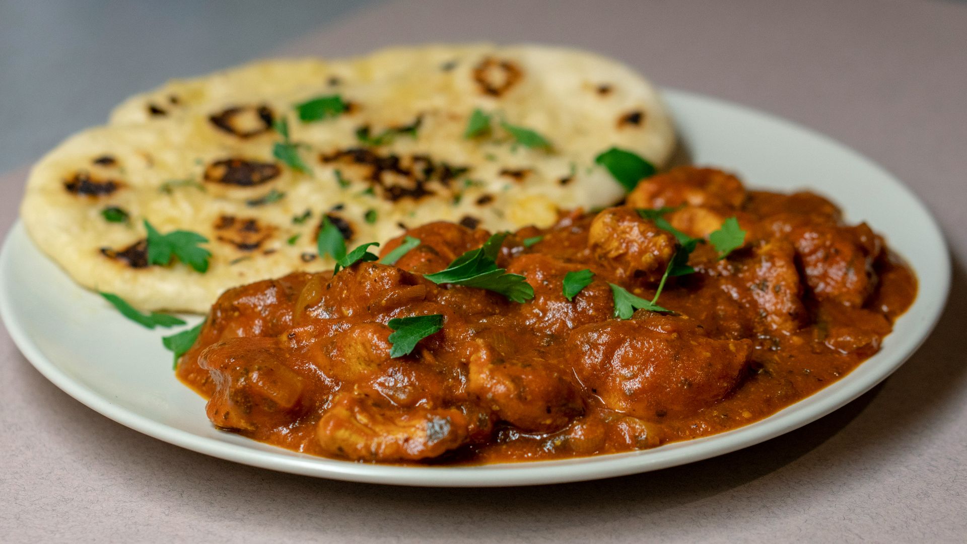 roti and meat slices with sauce on plate