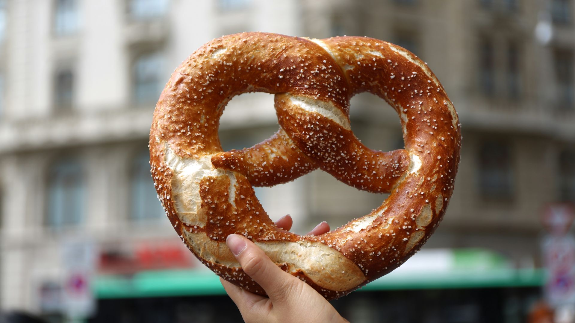 person holding pretzel