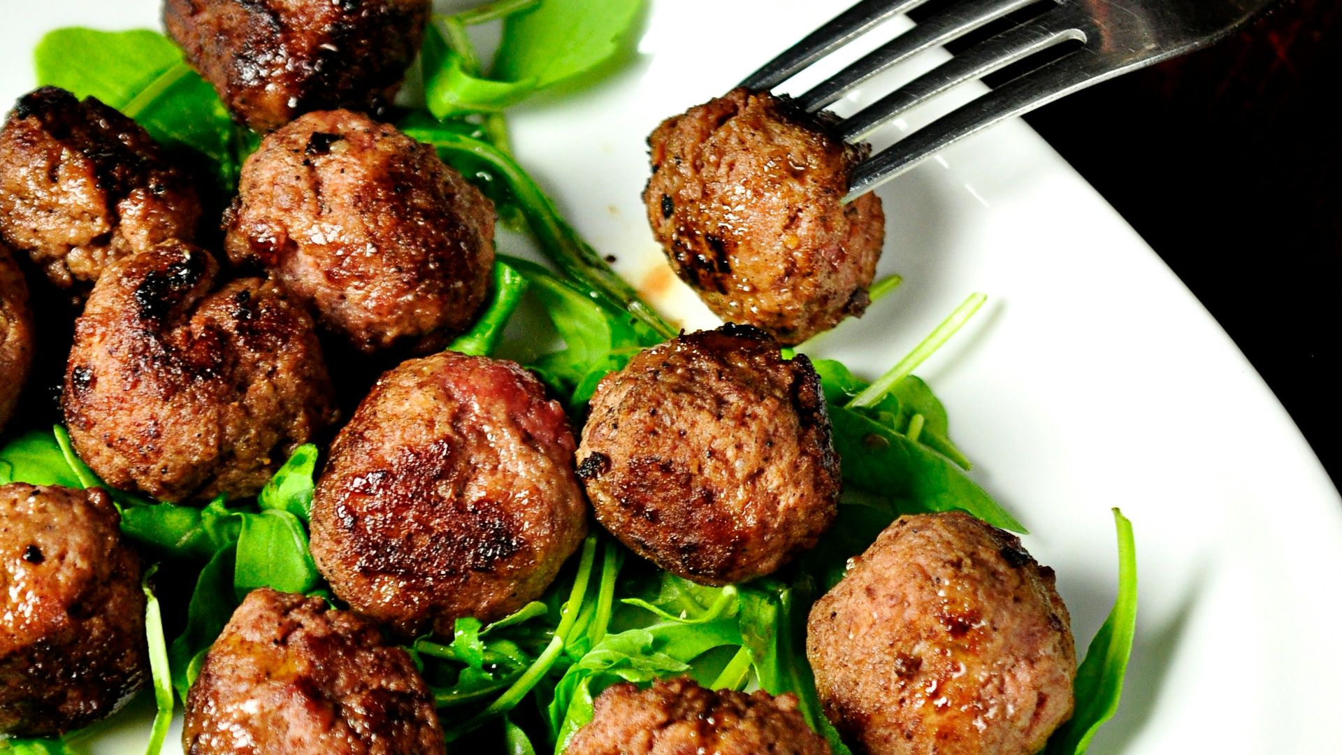 meat balls on oval white plate