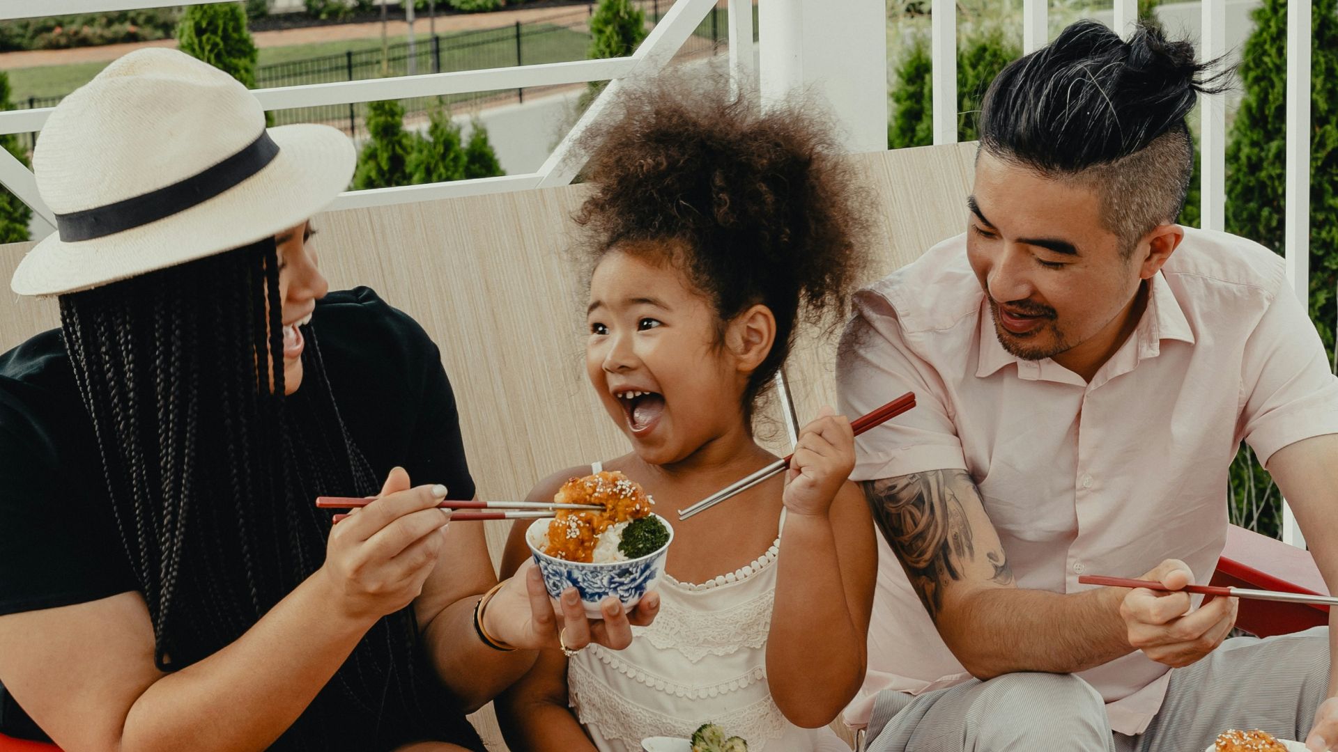 woman in white button up shirt sitting on red chair