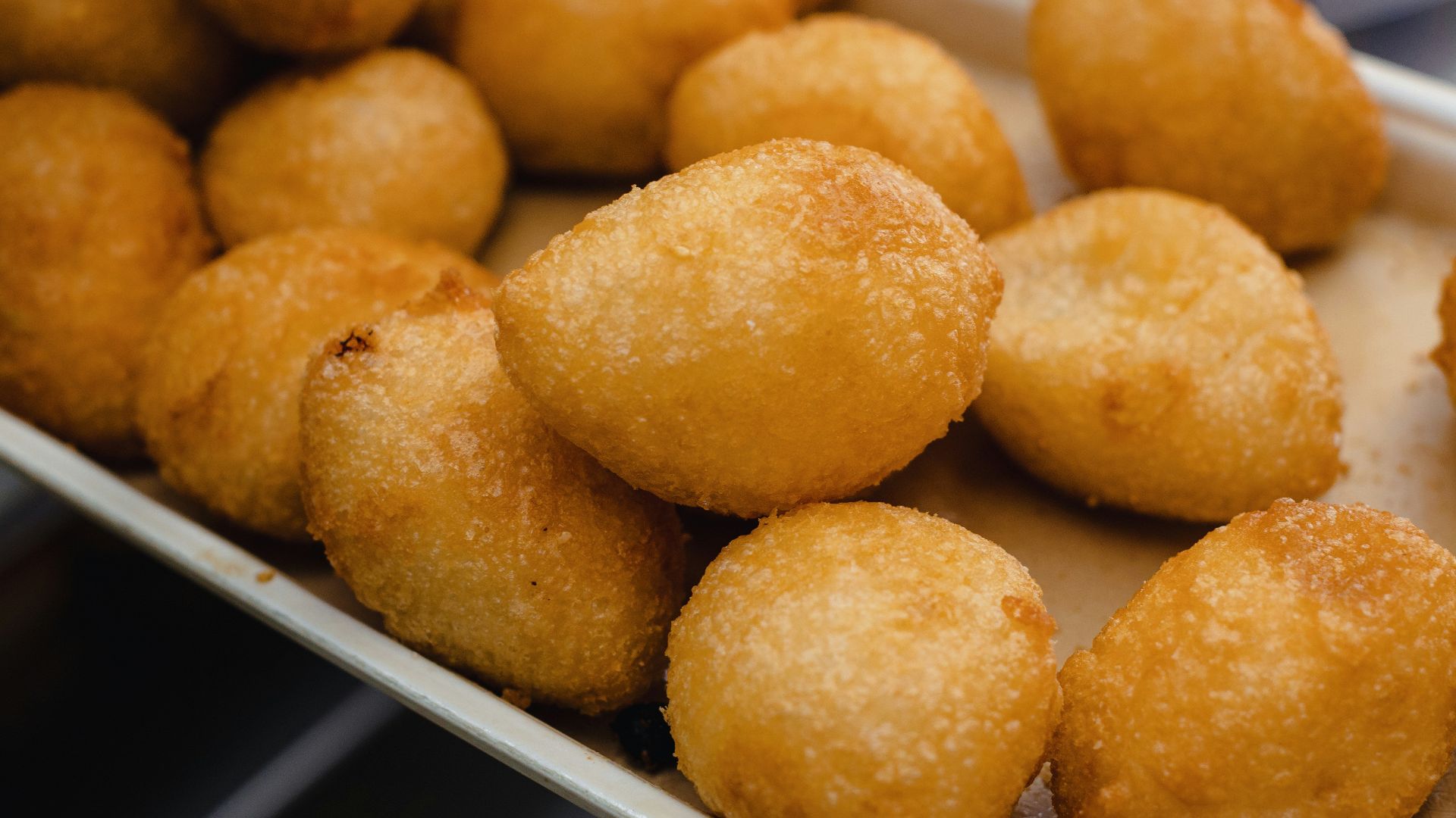 a bunch of doughnuts that are on a tray