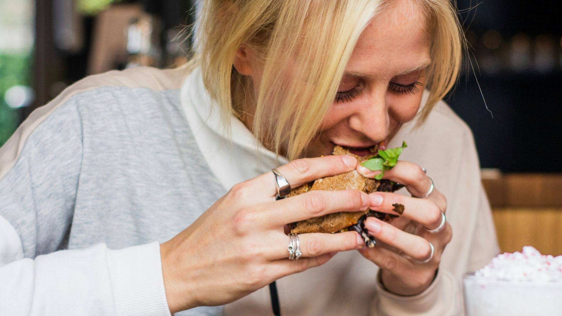 woman eating burger