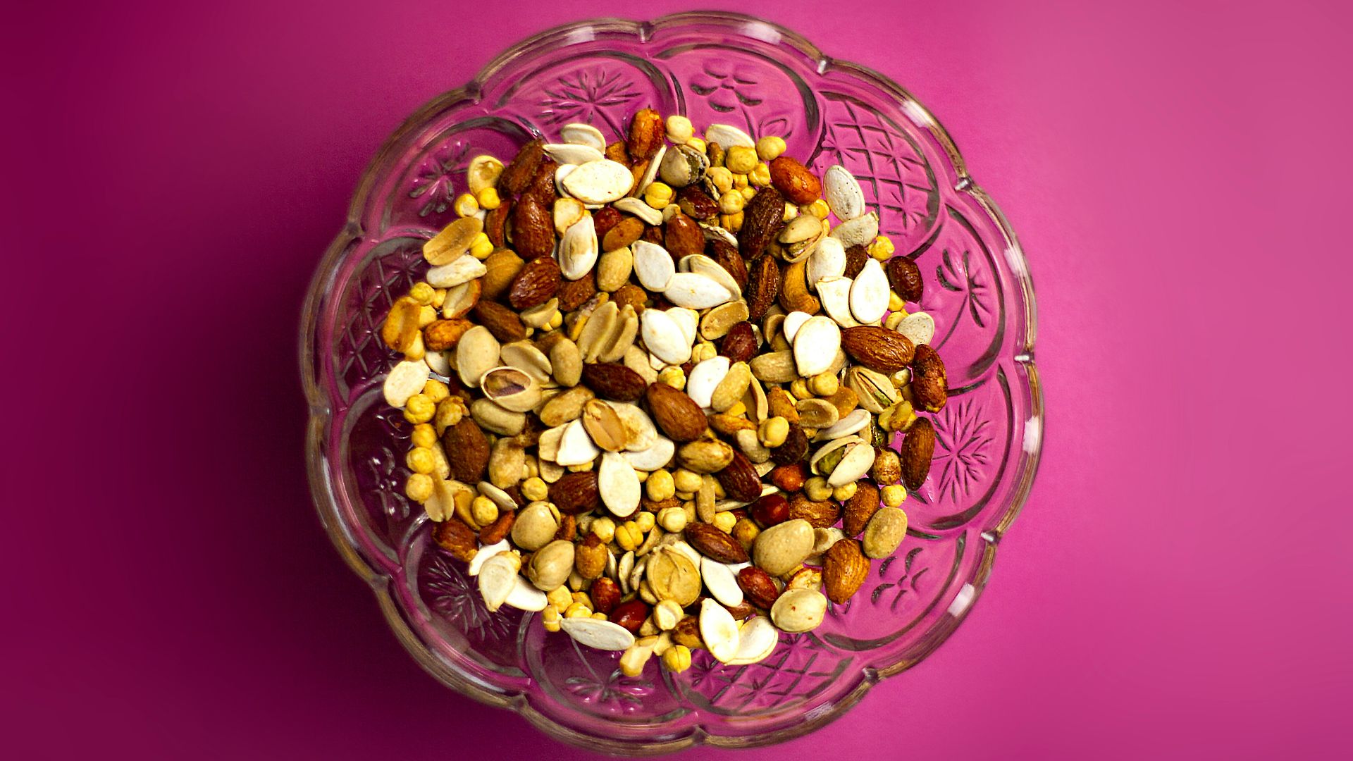 brown and white nuts on clear glass bowl