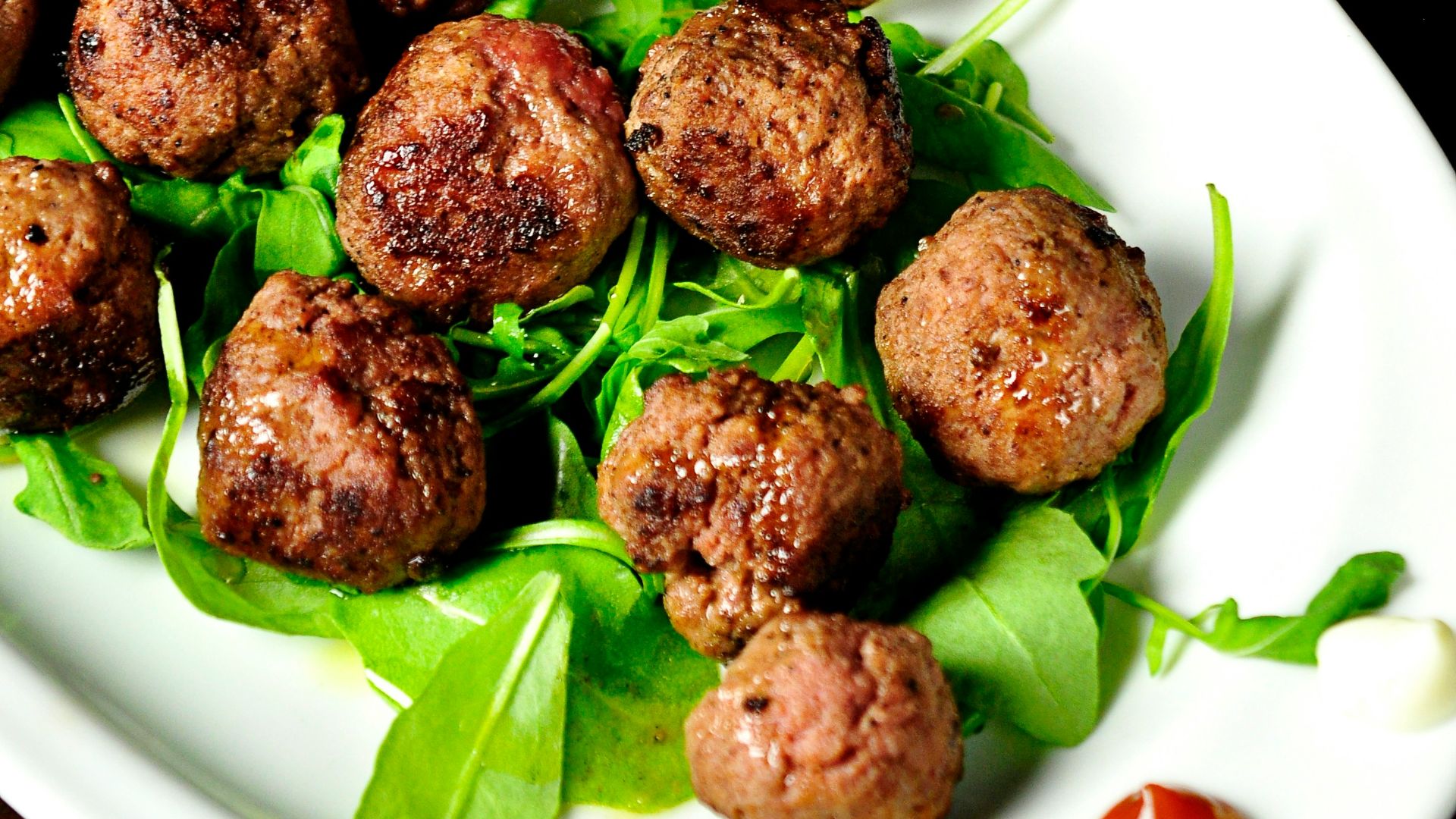 meat balls on oval white plate