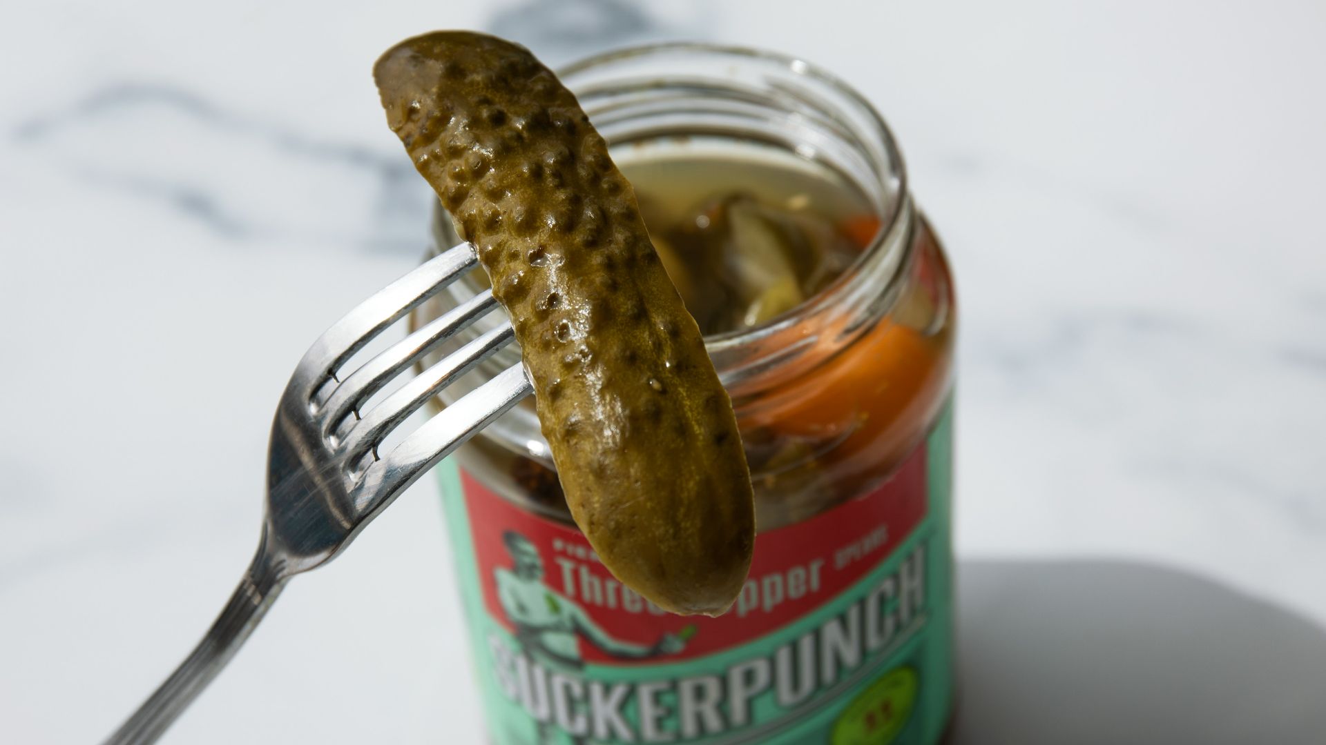 stainless steel fork on green labeled can