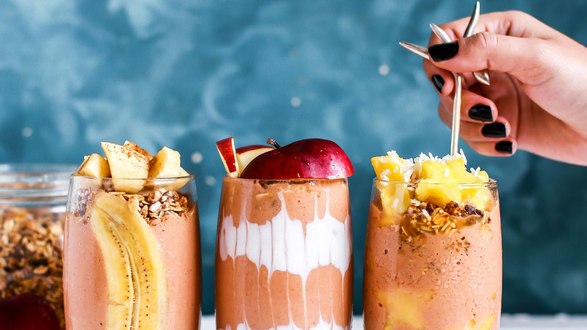 three clear drinking glass filled by shakes