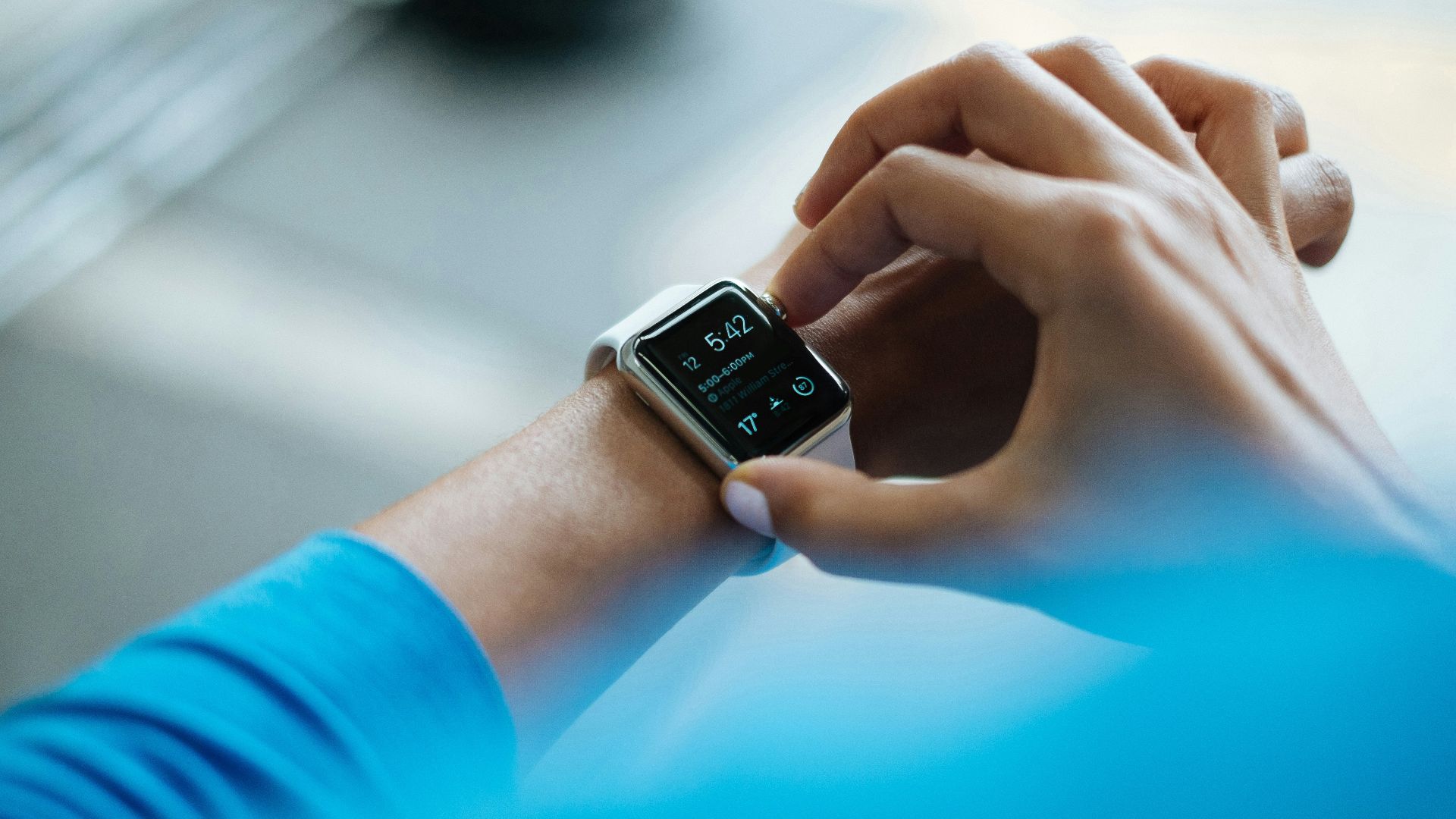 person clicking Apple Watch smartwatch