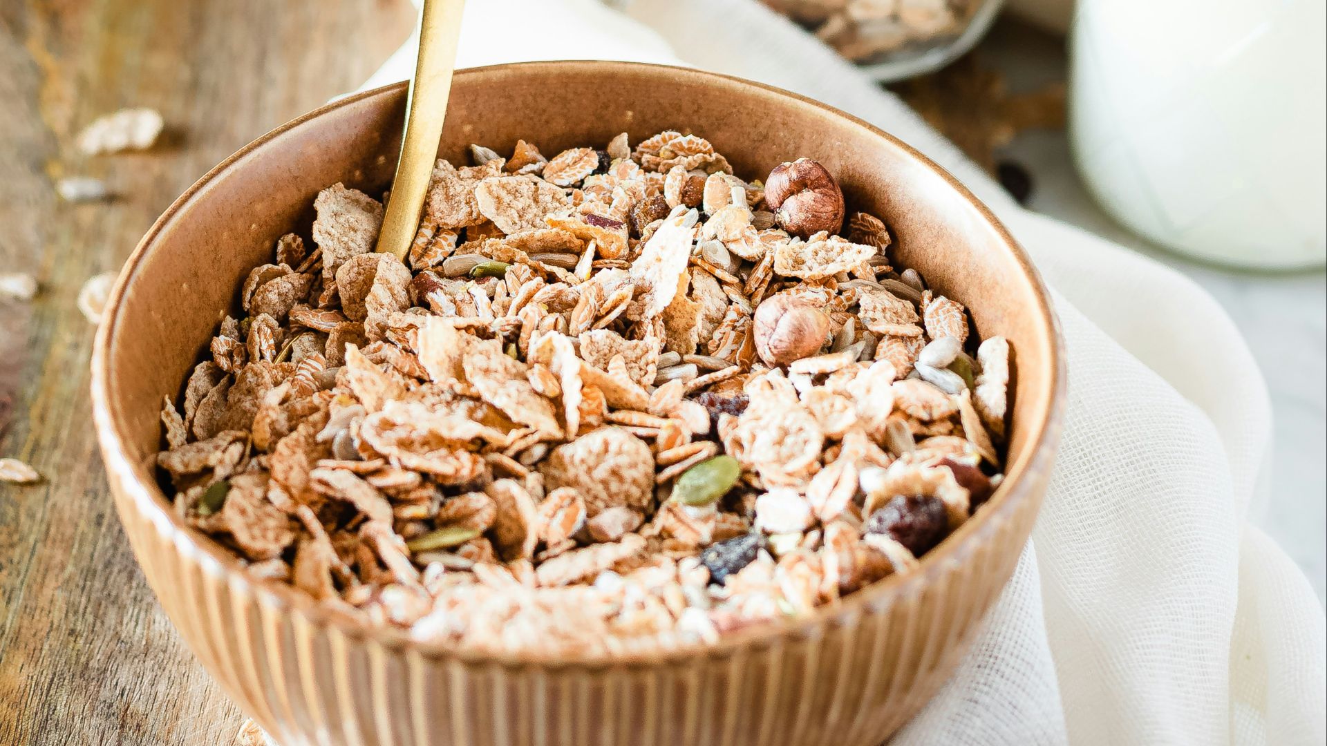 brown wooden bowl with brown wooden spoon