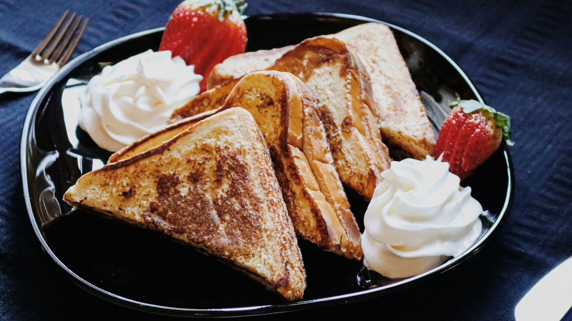 bread on black ceramic plate