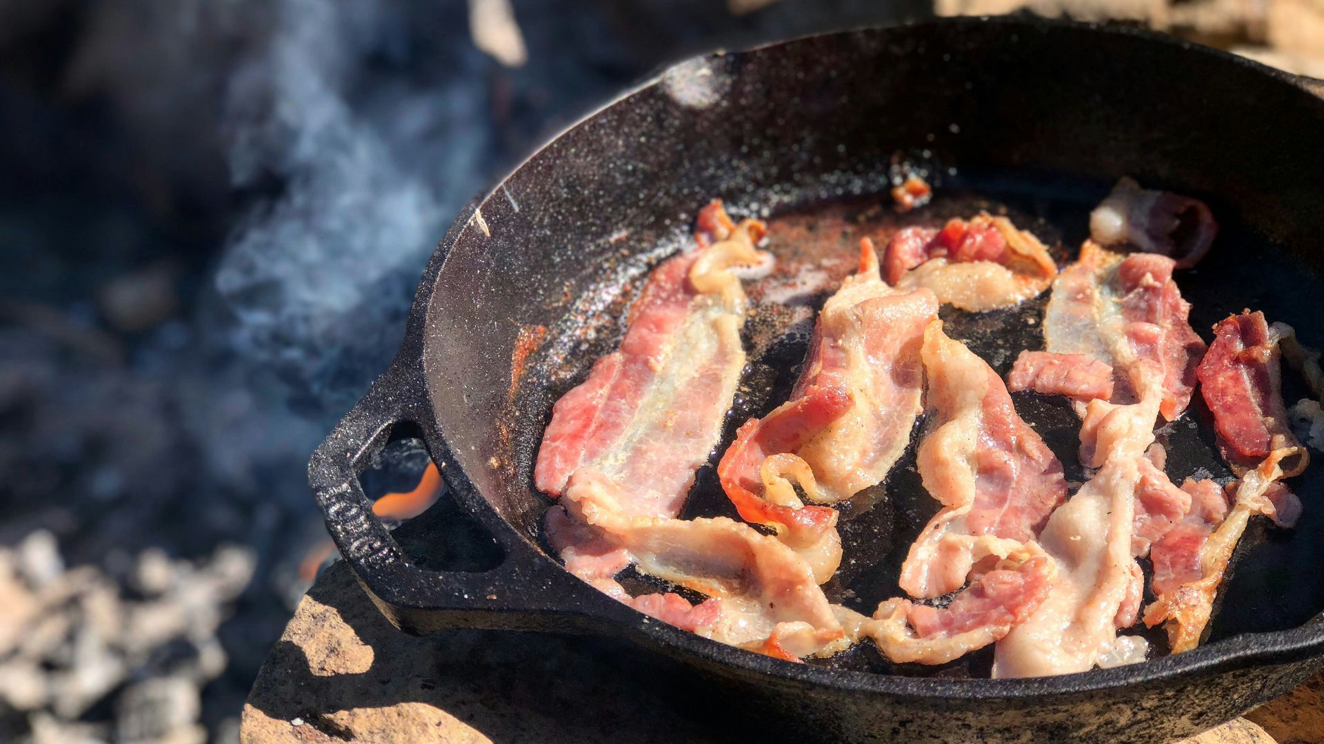 fried bacon in frying pan