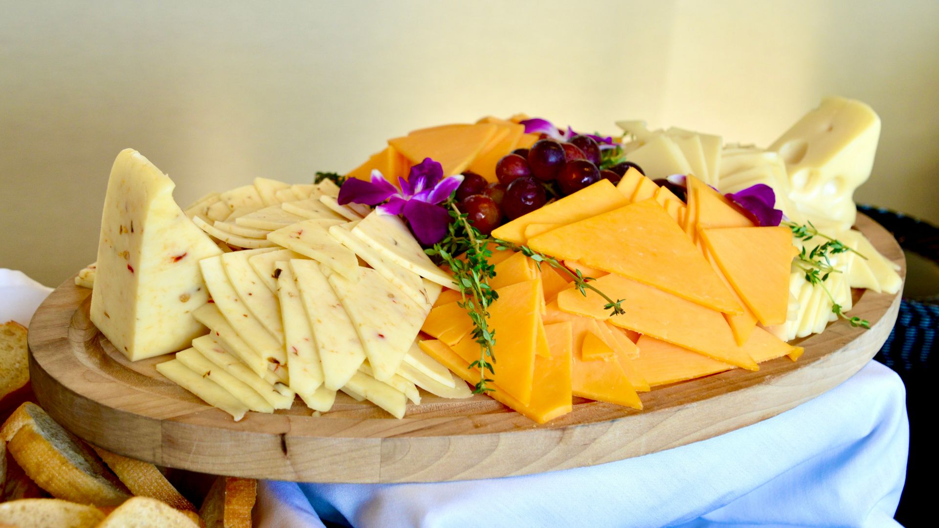 sliced cheese on brown wooden chopping board
