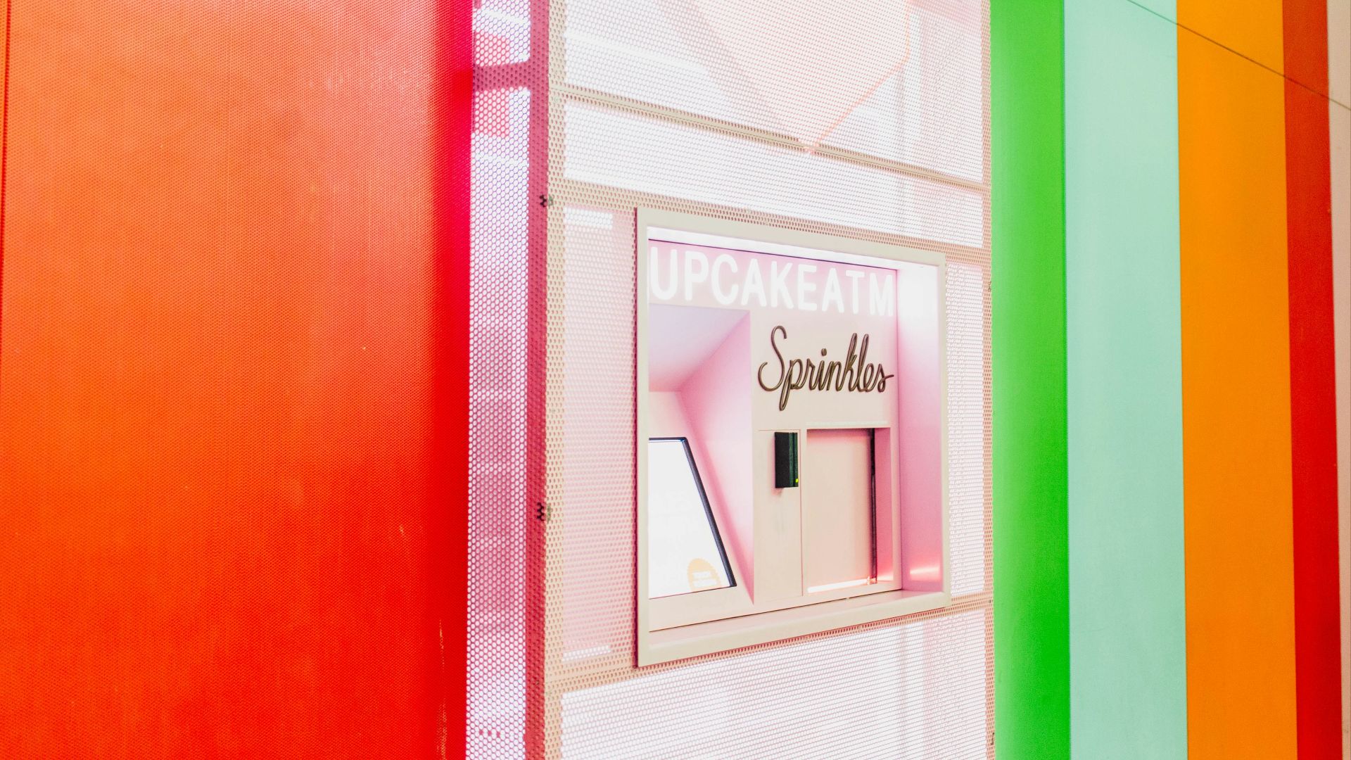 a brightly colored wall with a sign on it