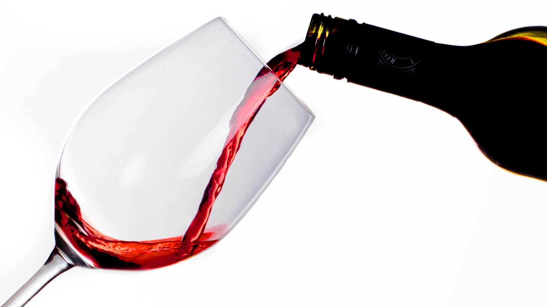 clear glass bottle with red liquid