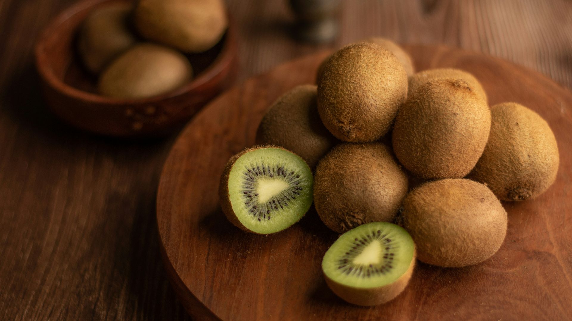brown round fruit on brown wooden table