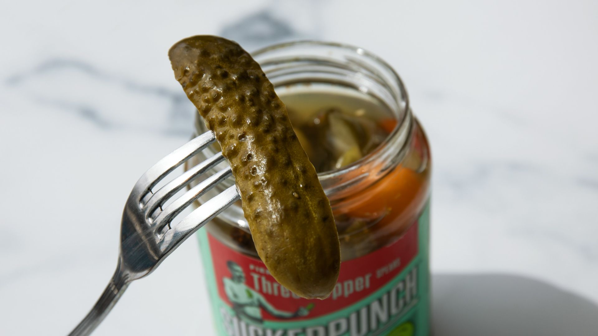 stainless steel fork on green labeled can