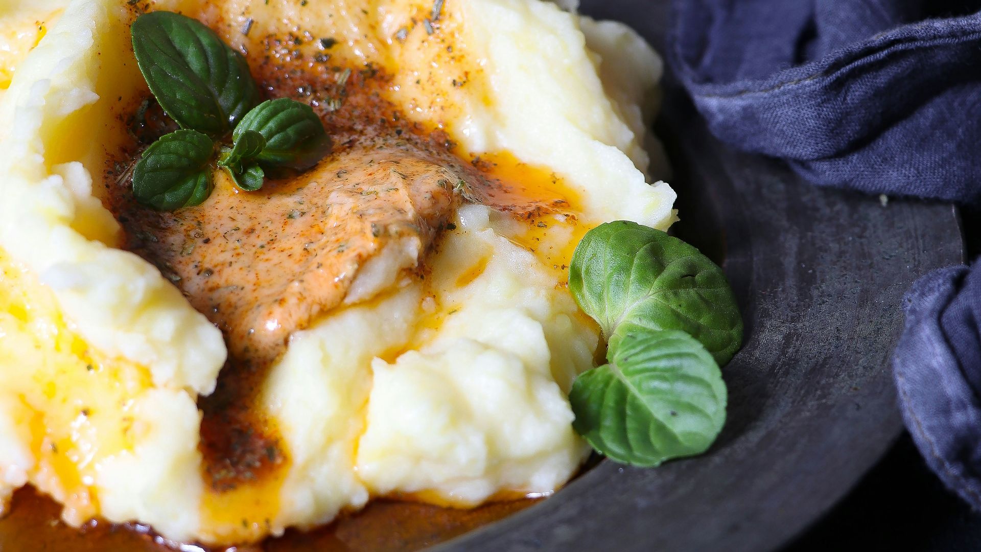 a plate of mashed potatoes topped with gravy