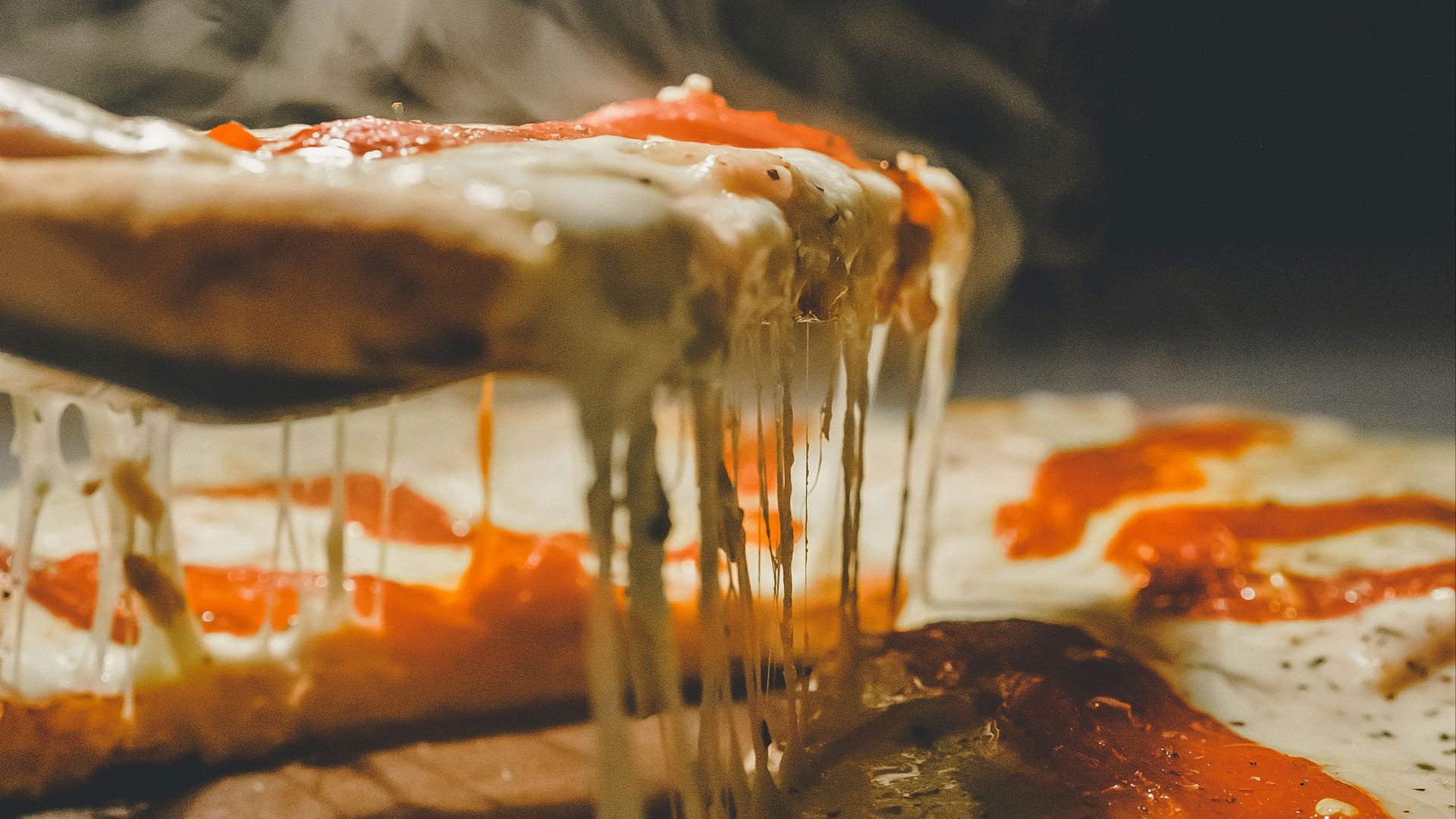 close up photo of pizza with cheese