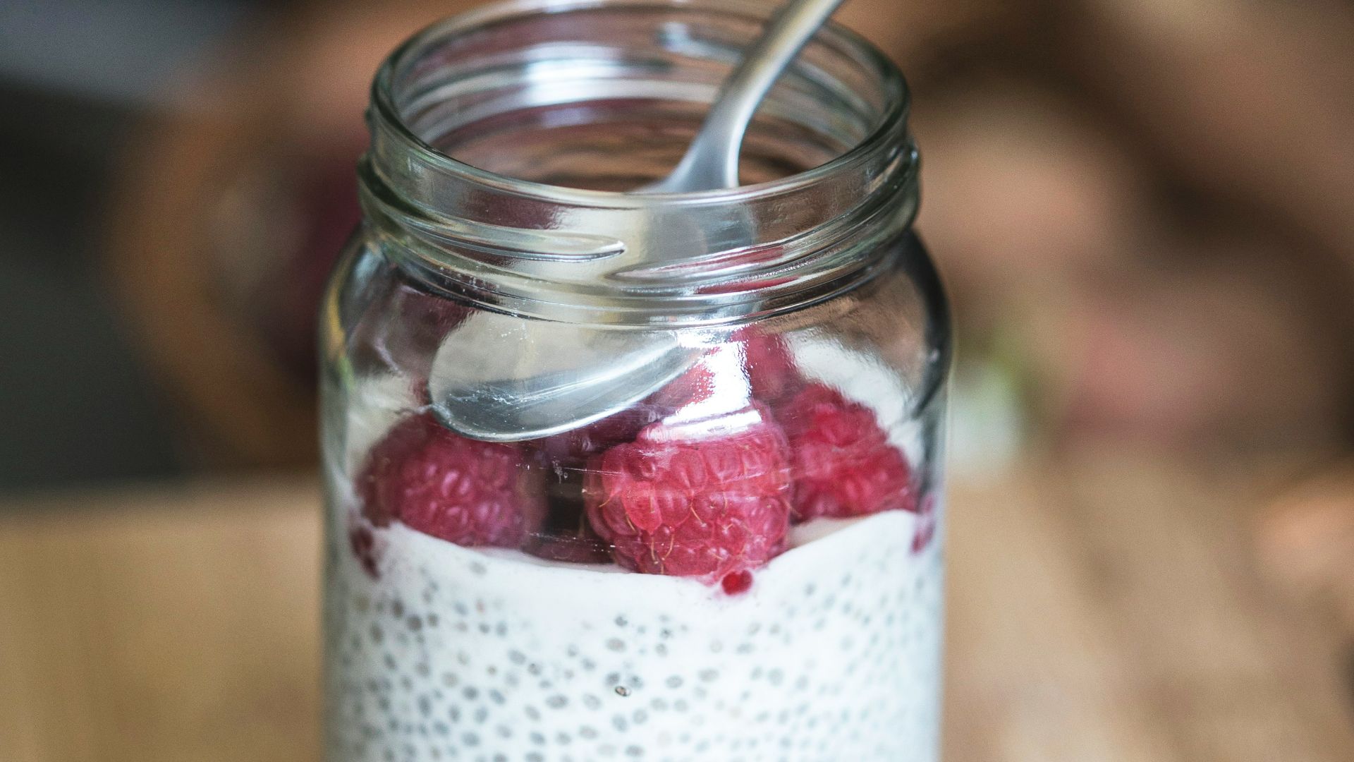 red cherries on clear glass bowl