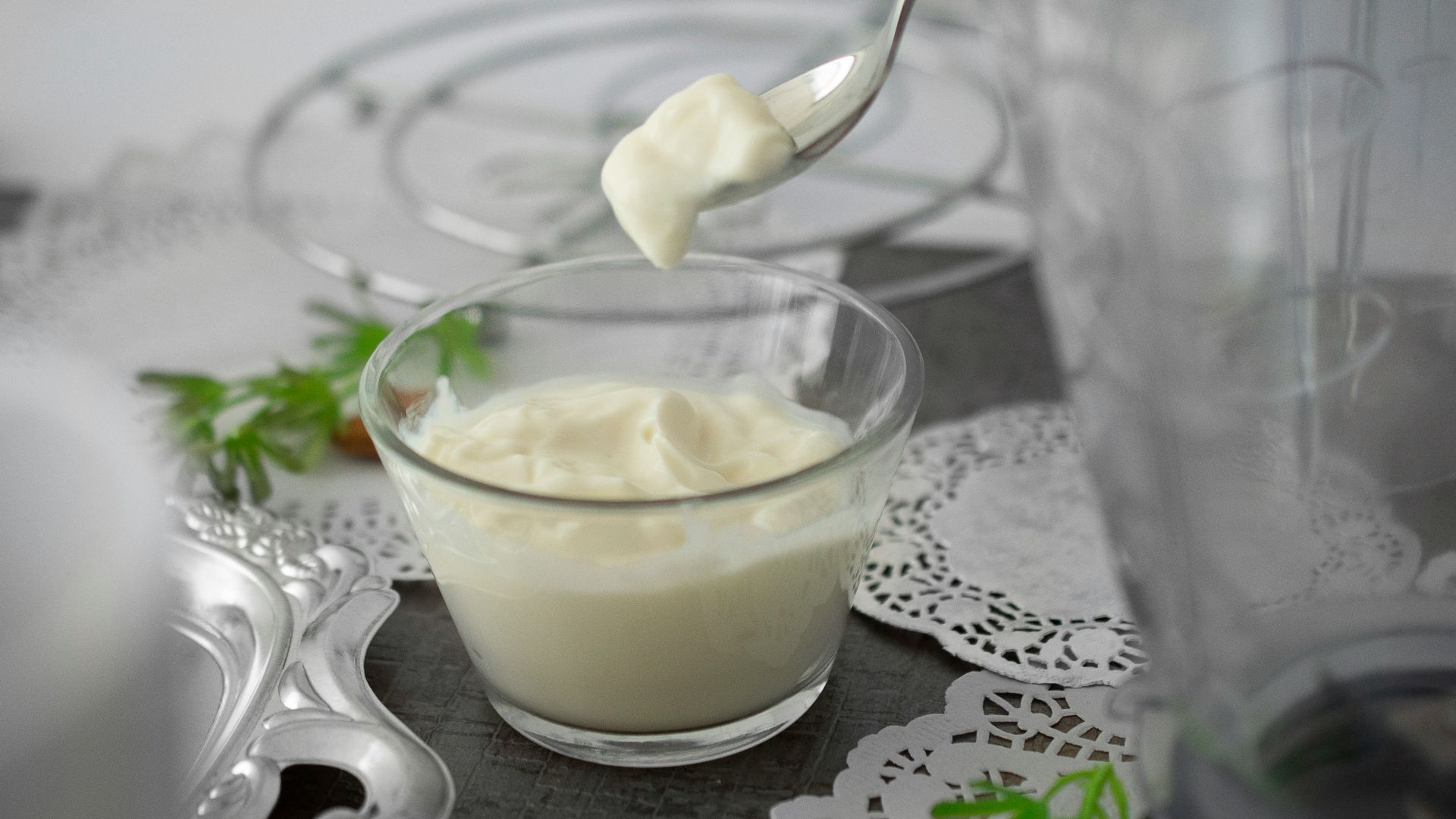 close-up photo of white cream in clear shot glass