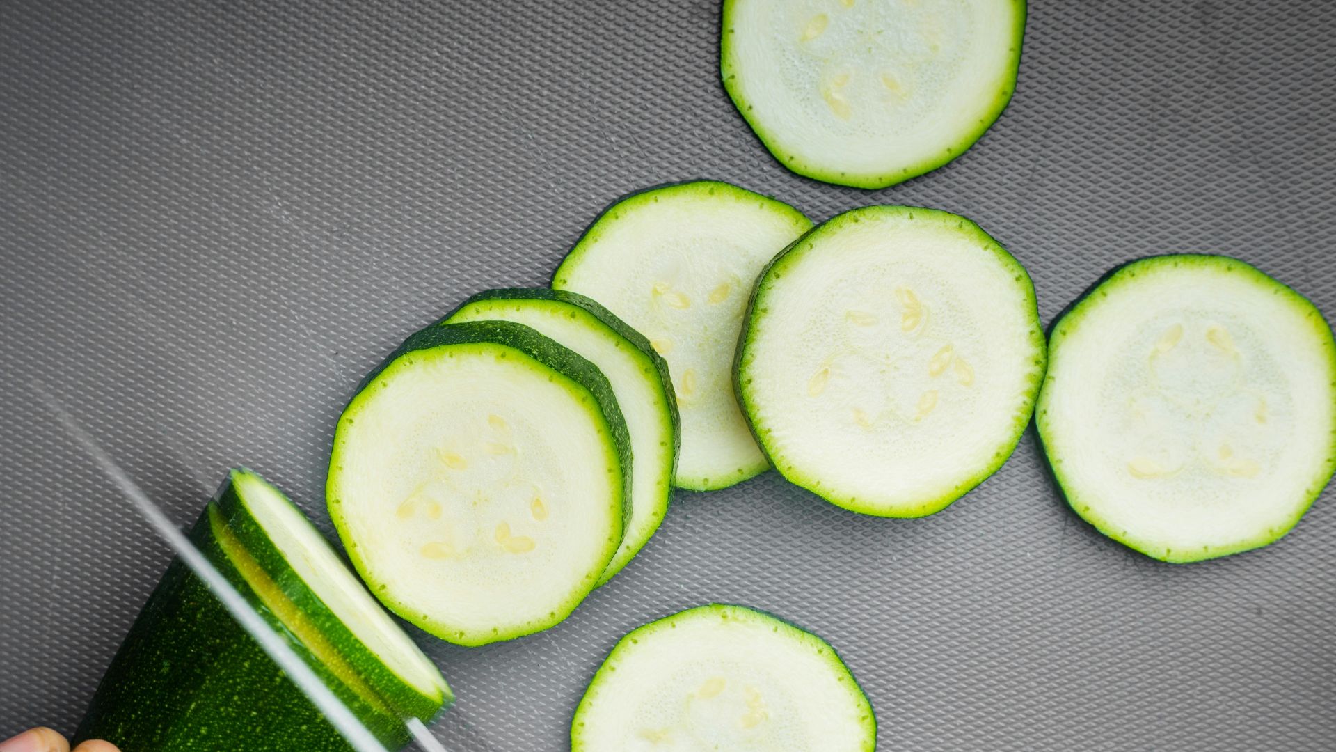 sliced cucumber on black textile