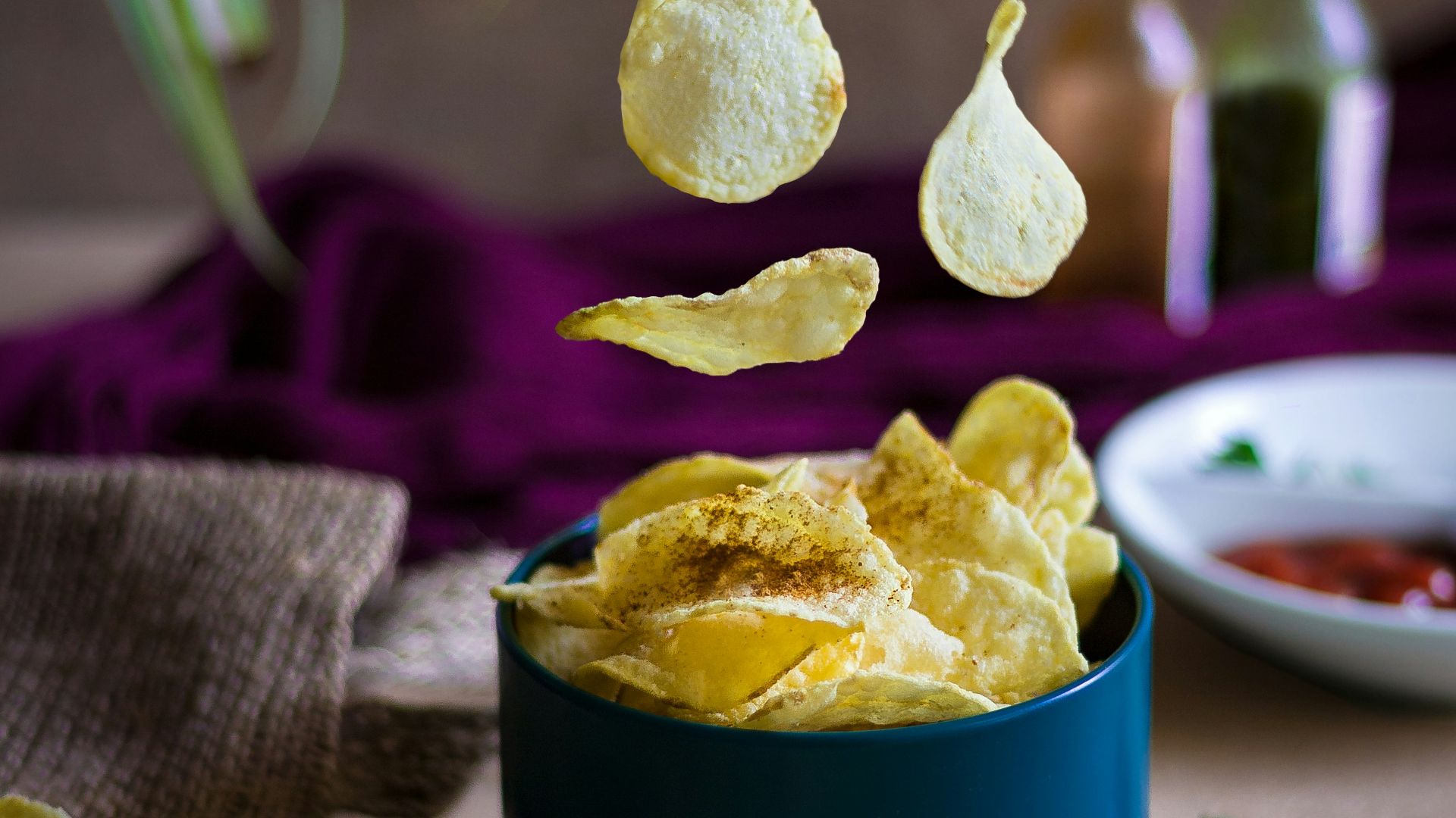 blue ceramic mug on green table cloth