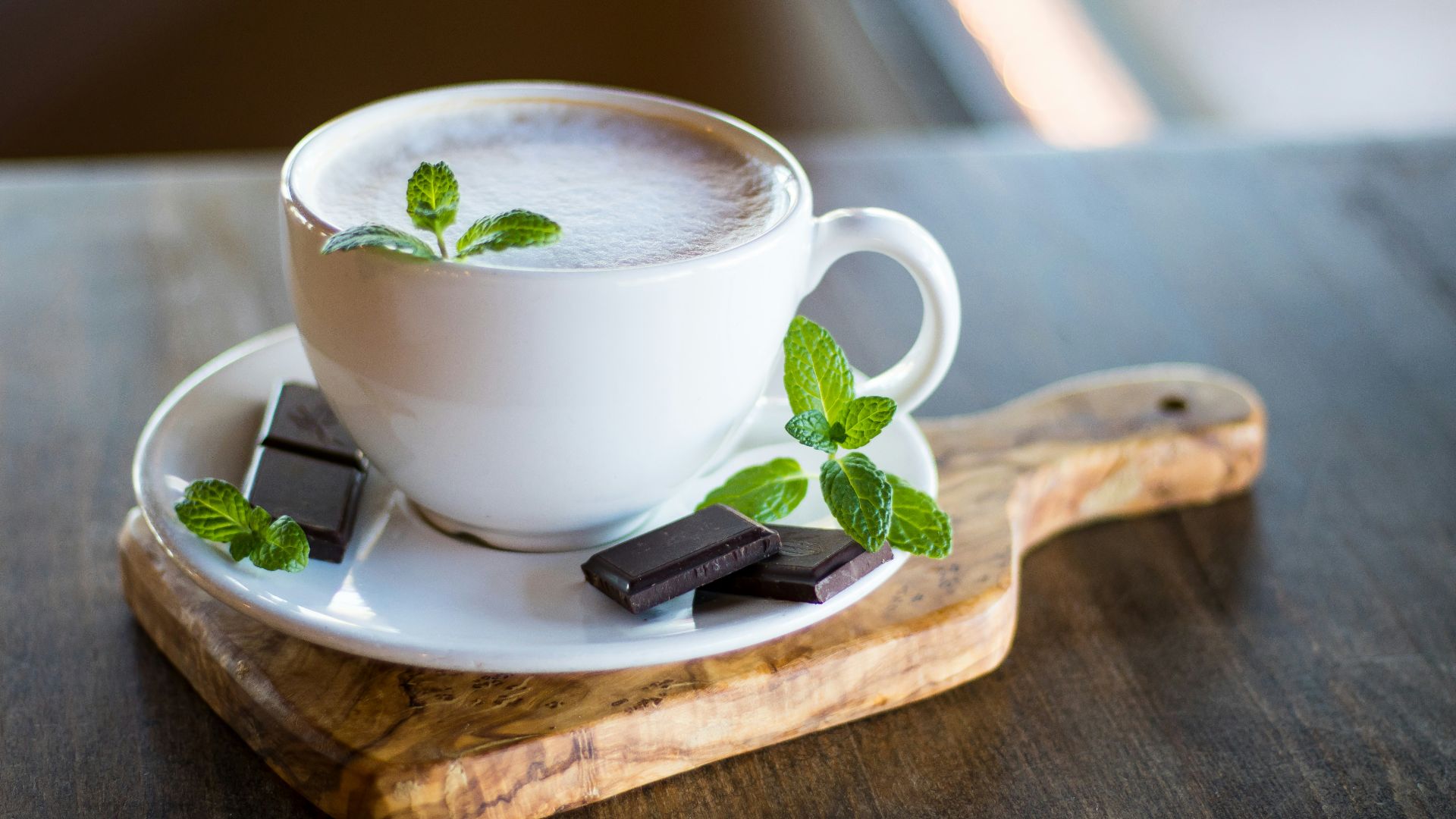 filled teacup with chocolate bars on saucer