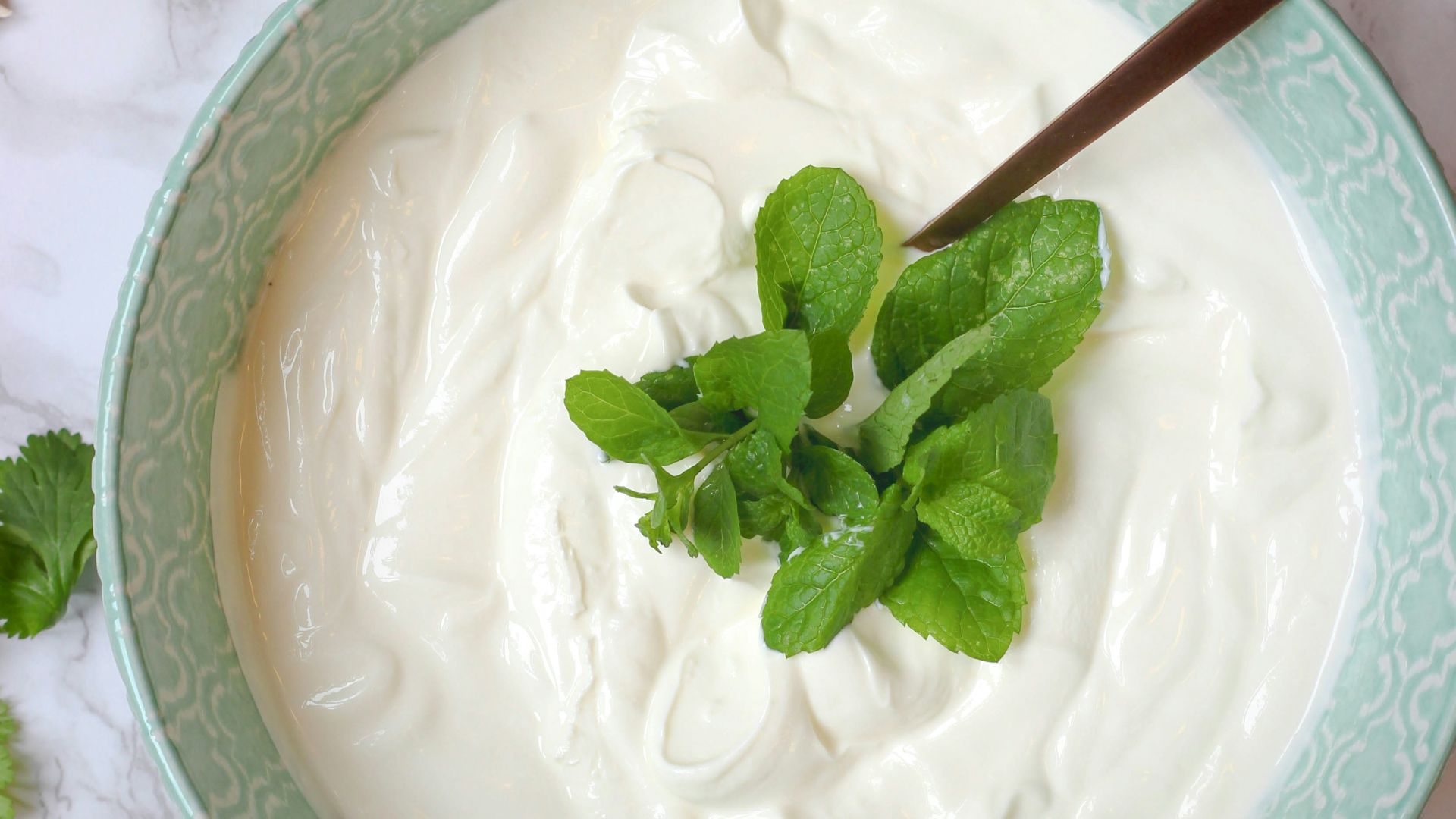 a bowl of yogurt with a spoon in it