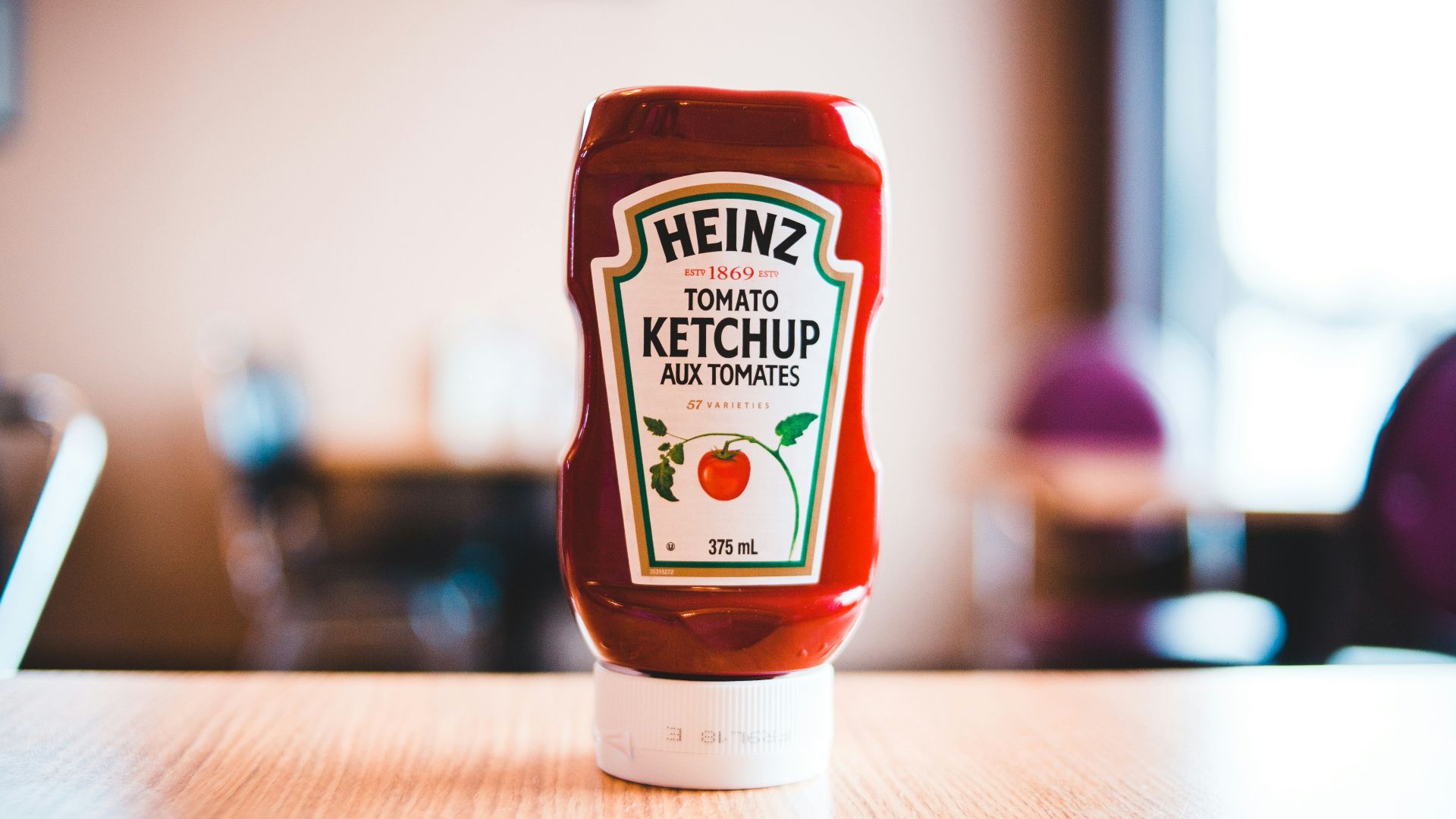 heinz tomato ketchup bottle on brown wooden table
