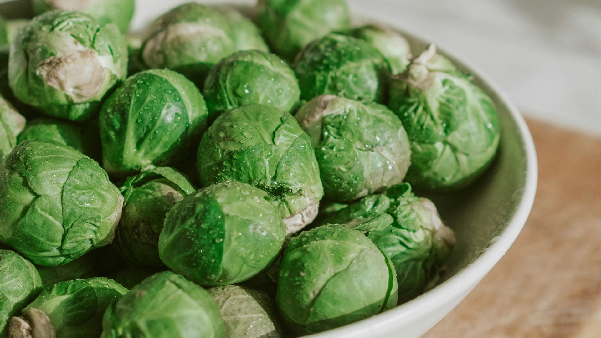 green vegetable on white ceramic bowl