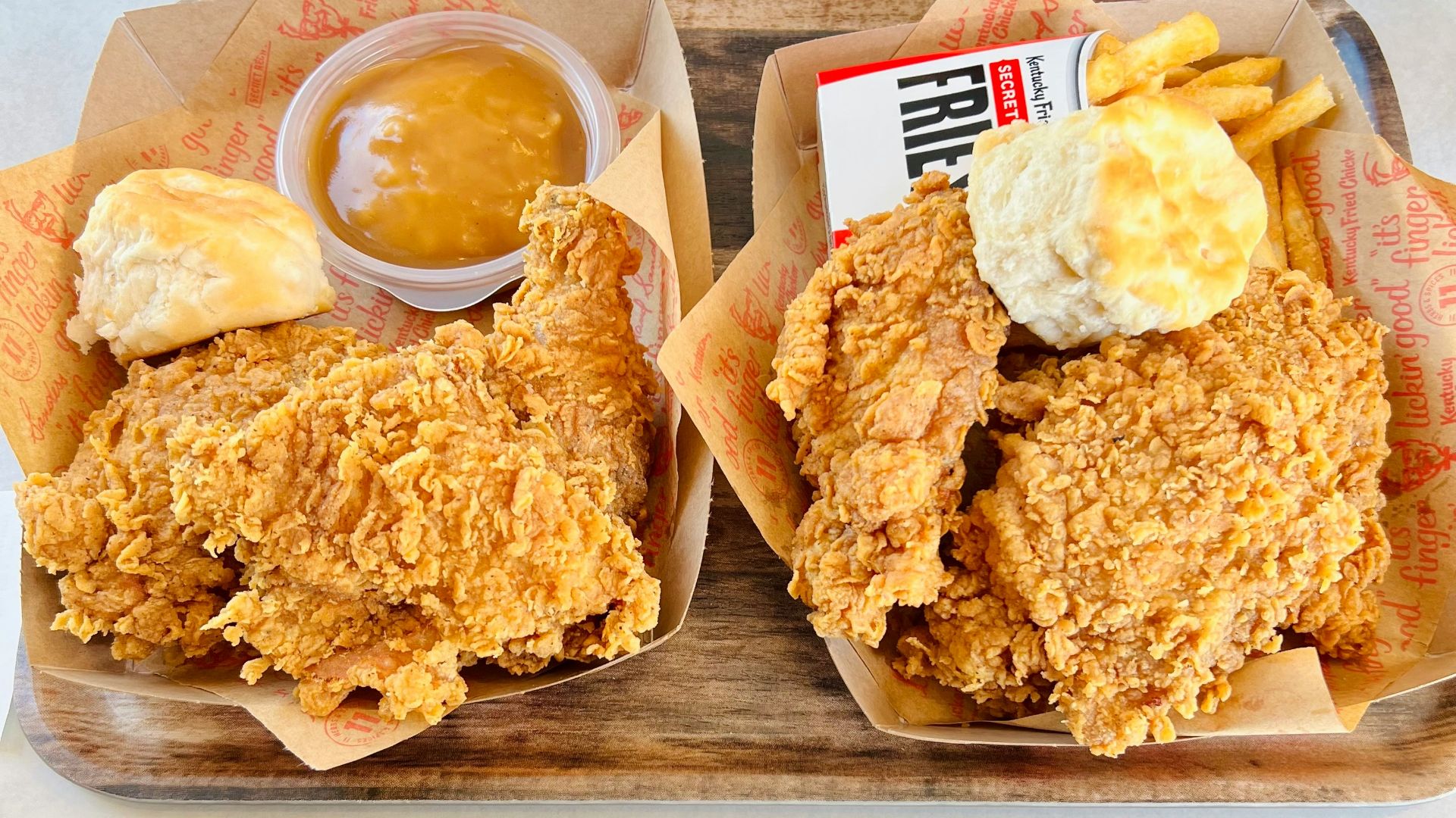 a couple of trays of food on a table