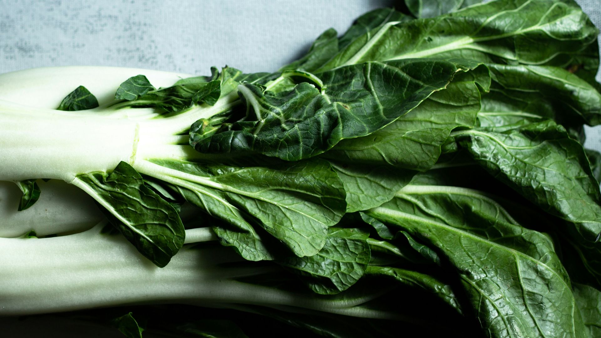 green vegetable on white ceramic plate