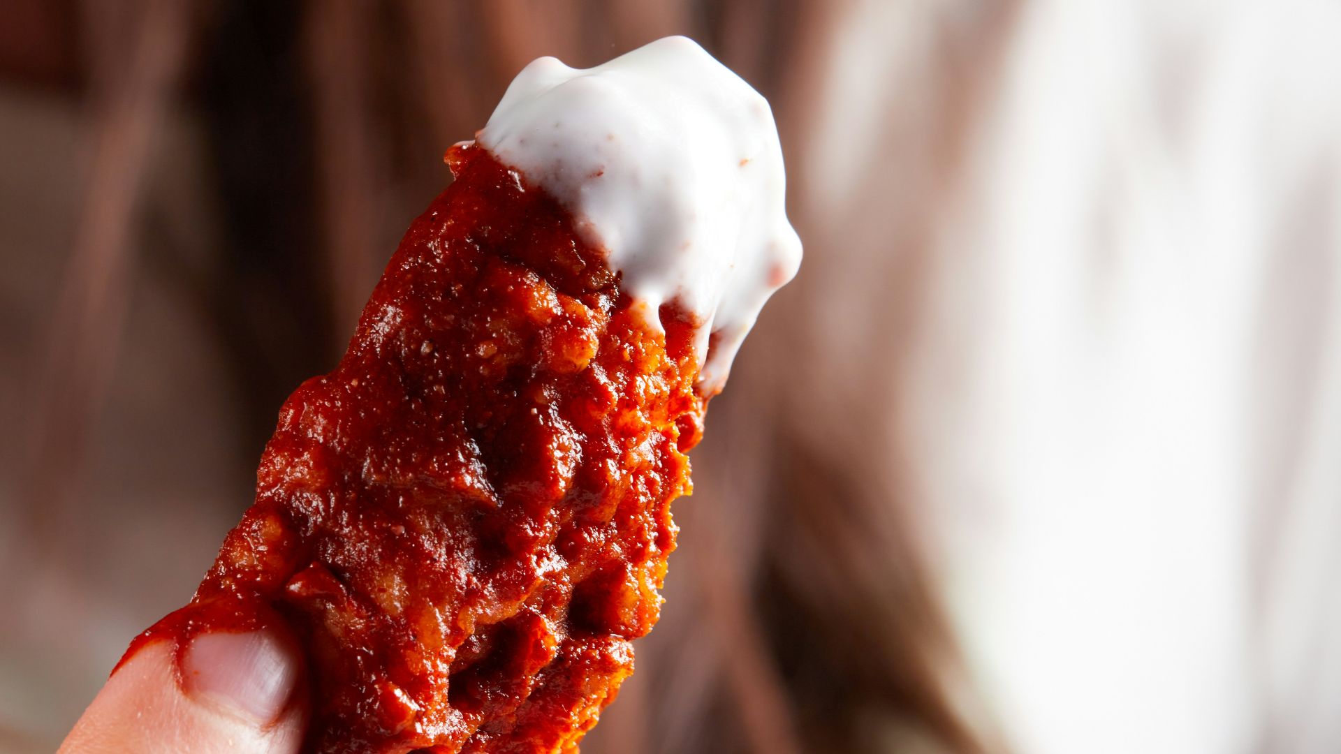 person holding brown and white ice cream
