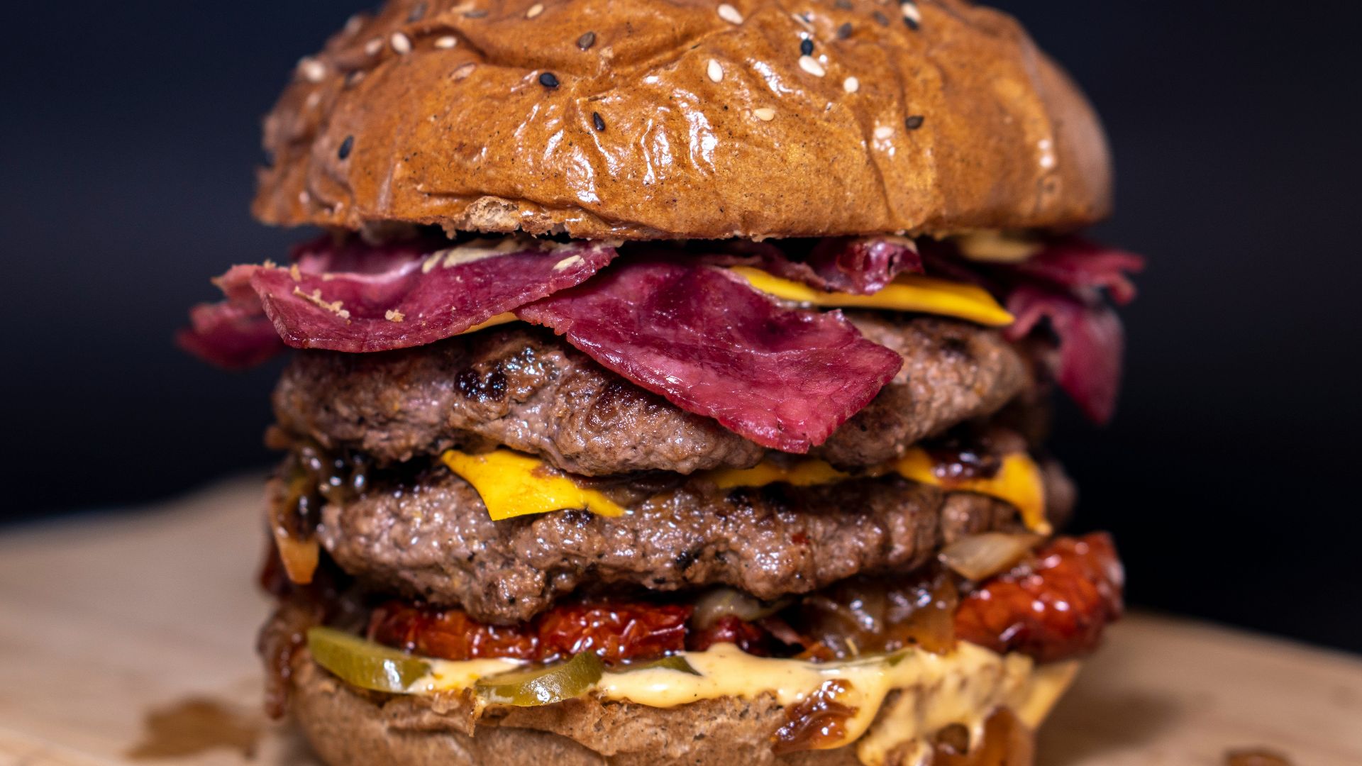 closeup photo of burger on brown surface