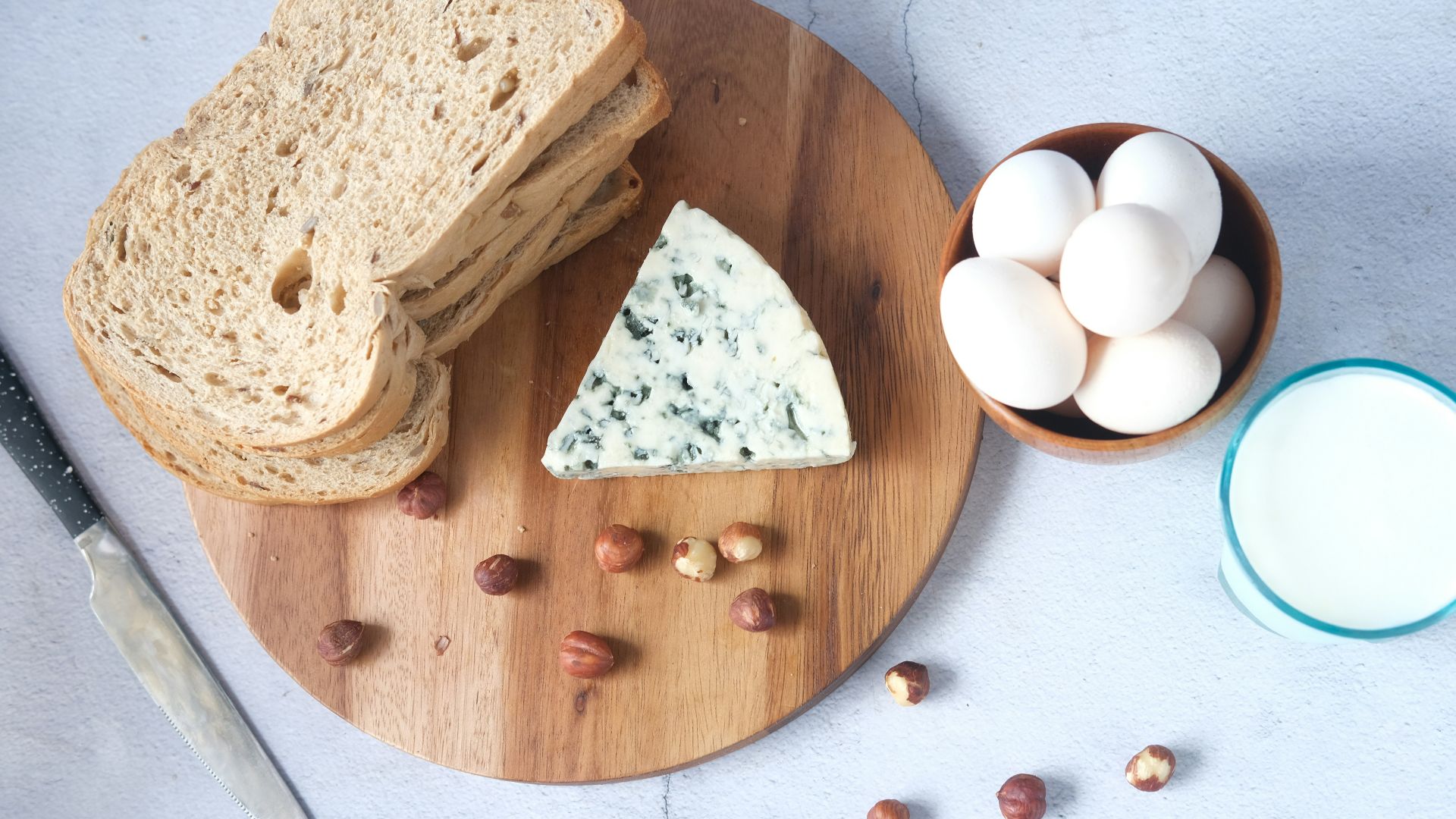 sliced bread on brown wooden chopping board