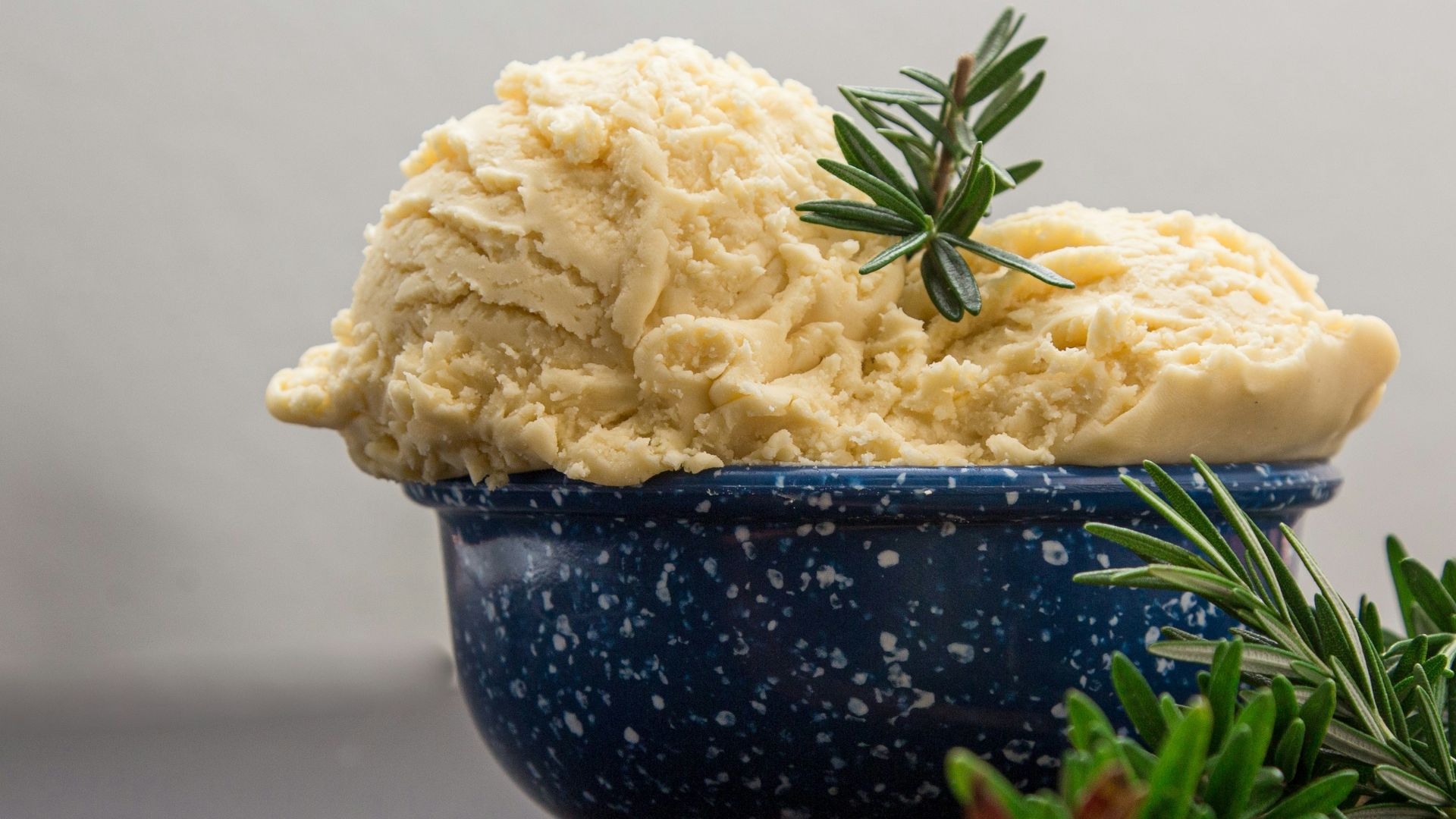 brown wooden spoon on blue ceramic bowl