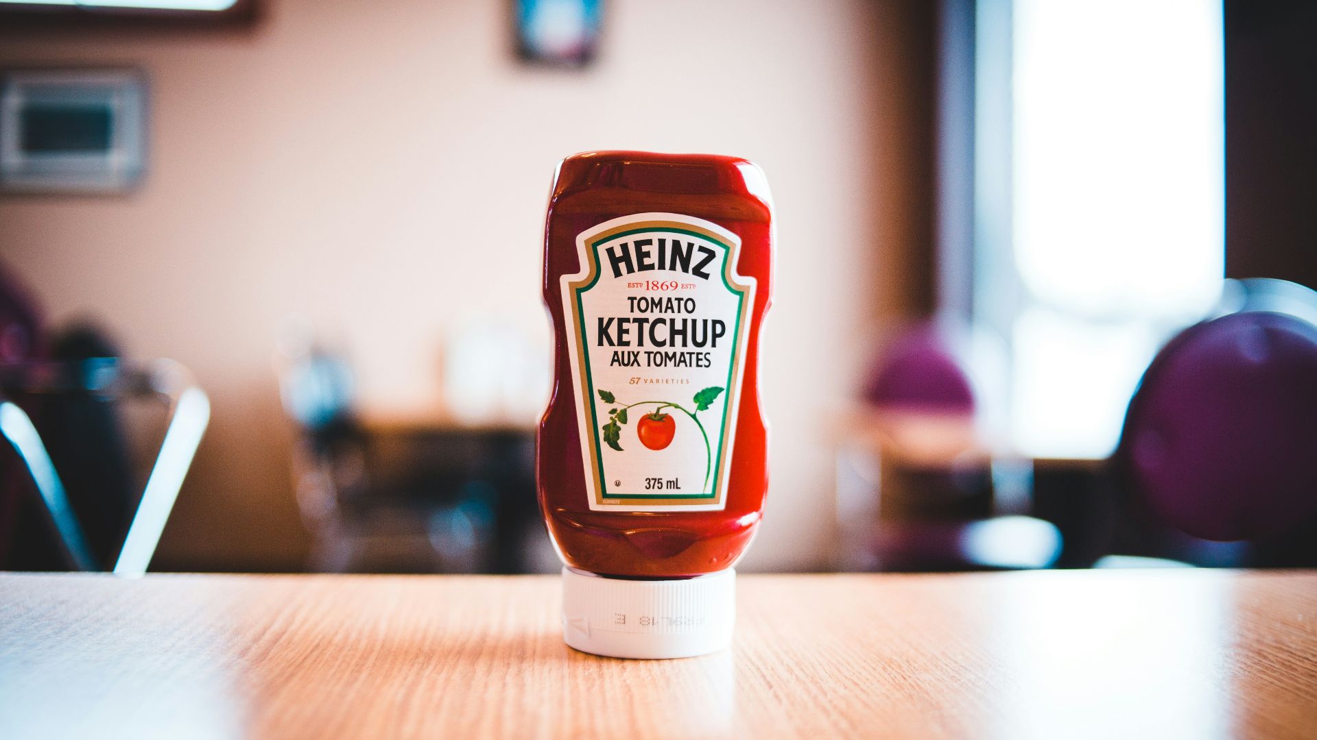 heinz tomato ketchup bottle on brown wooden table