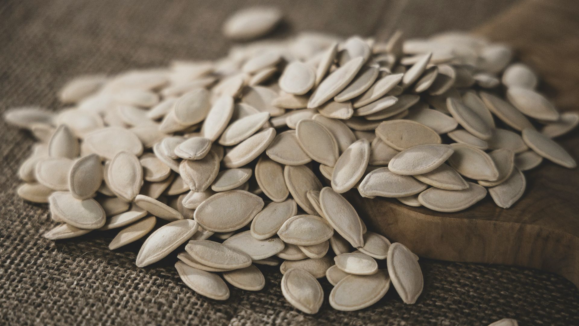 brown seeds on brown wooden surface