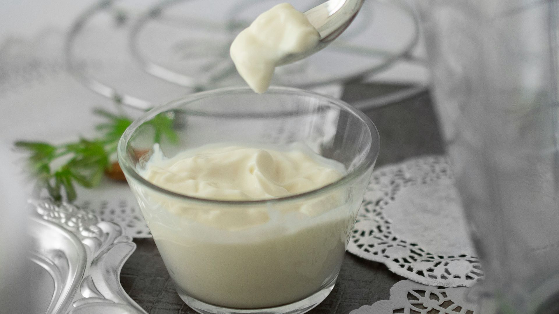 close-up photo of white cream in clear shot glass